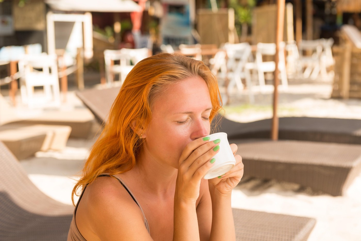 Young woman drinking coffee at beach in the morning,Image: 321756938, License: Royalty-free, Restrictions: , Model Release: yes, Credit line: Nikita Buida / Alamy / Alamy / Profimedia