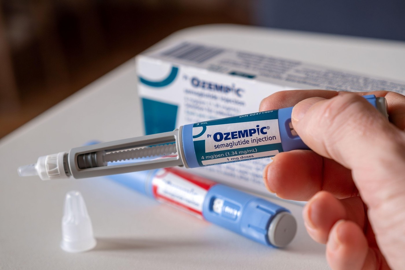 Montreal, CA - 25 November 2023: Hand holding Ozempic semaglutide injection pen. Ozempic is a medication for obesity
