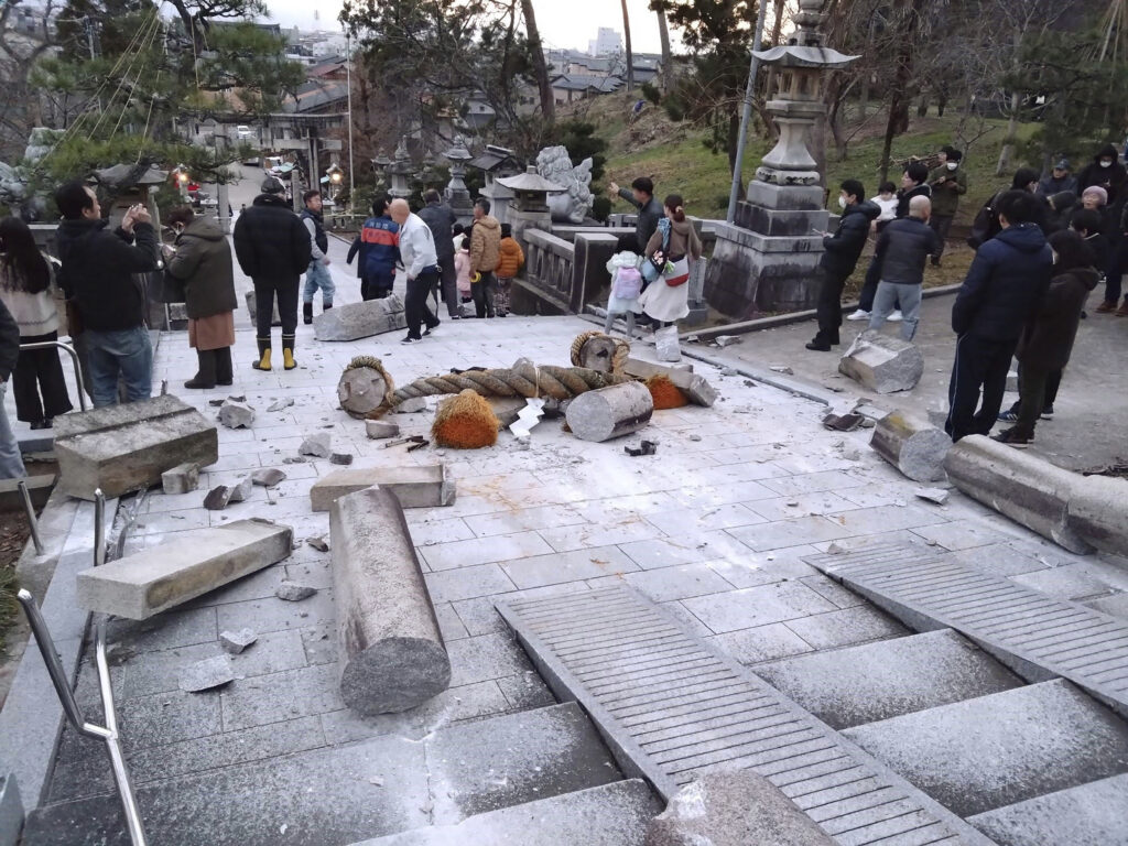 A torii gate is damaged after an earthquake at a shrine in Kanazawa, Ishikawa prefecture, Japan Monday, Jan. 1, 2024. Japan issued tsunami alerts Monday after a series of strong quakes in the Sea of Japan. (Kyodo News via AP)