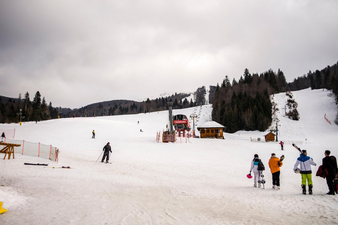 Snow slopes with skiers at resort, Kolasin, Montenegro