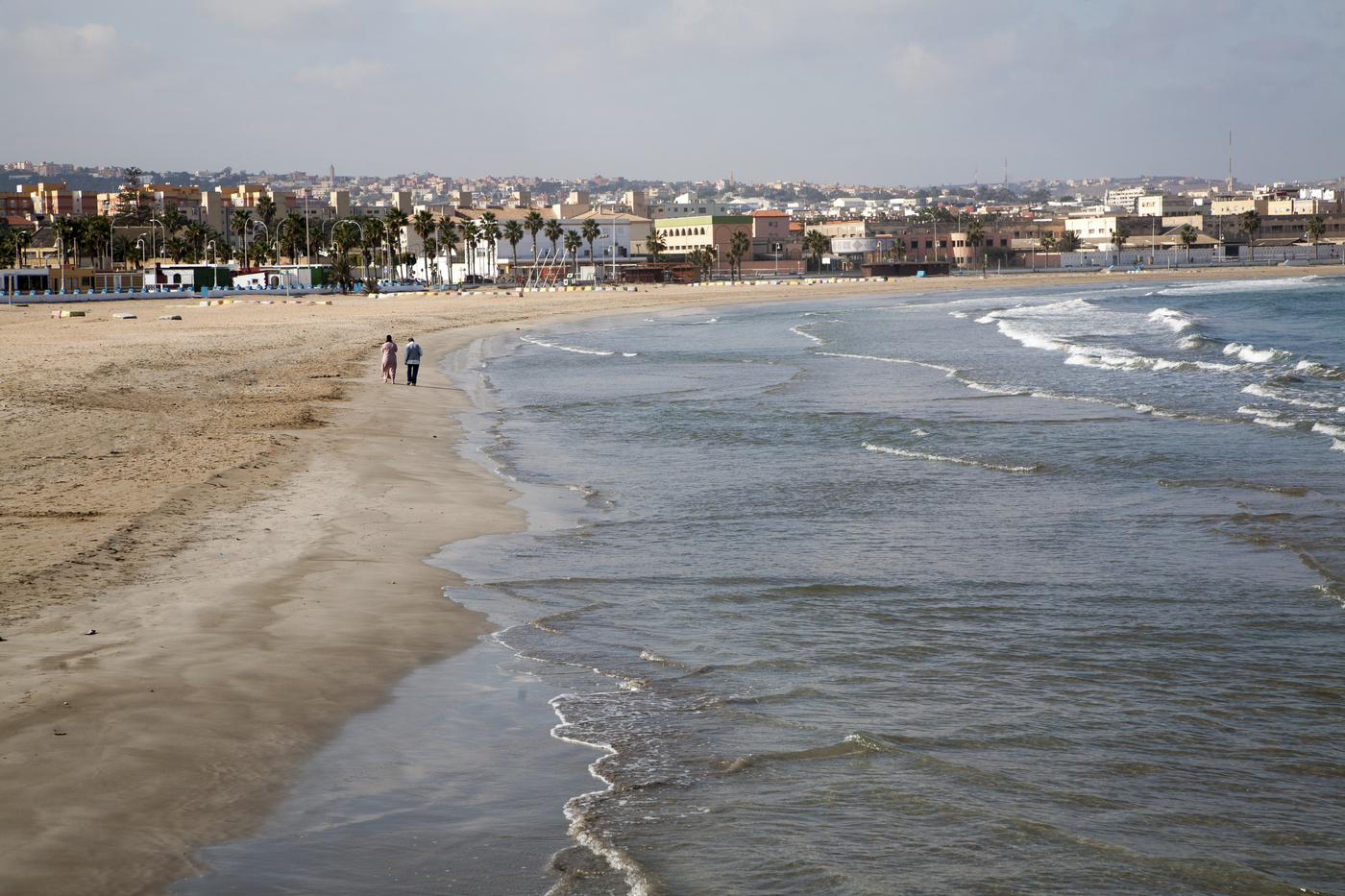 People walking on sandy beach Melilla autonomous city state Spanish territory in north Africa, Spain,Image: 835356482, License: Rights-managed, Restrictions: , Model Release: no, Credit line: Ian Murray / imageBROKER / Profimedia