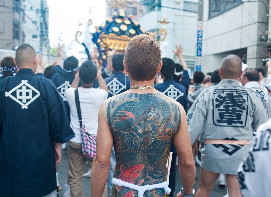Tokyo, Japan - May 2014 - Yakuza member portable Shinto Temples (Mikoshi) during the Sanja Matsuri in Asakusa