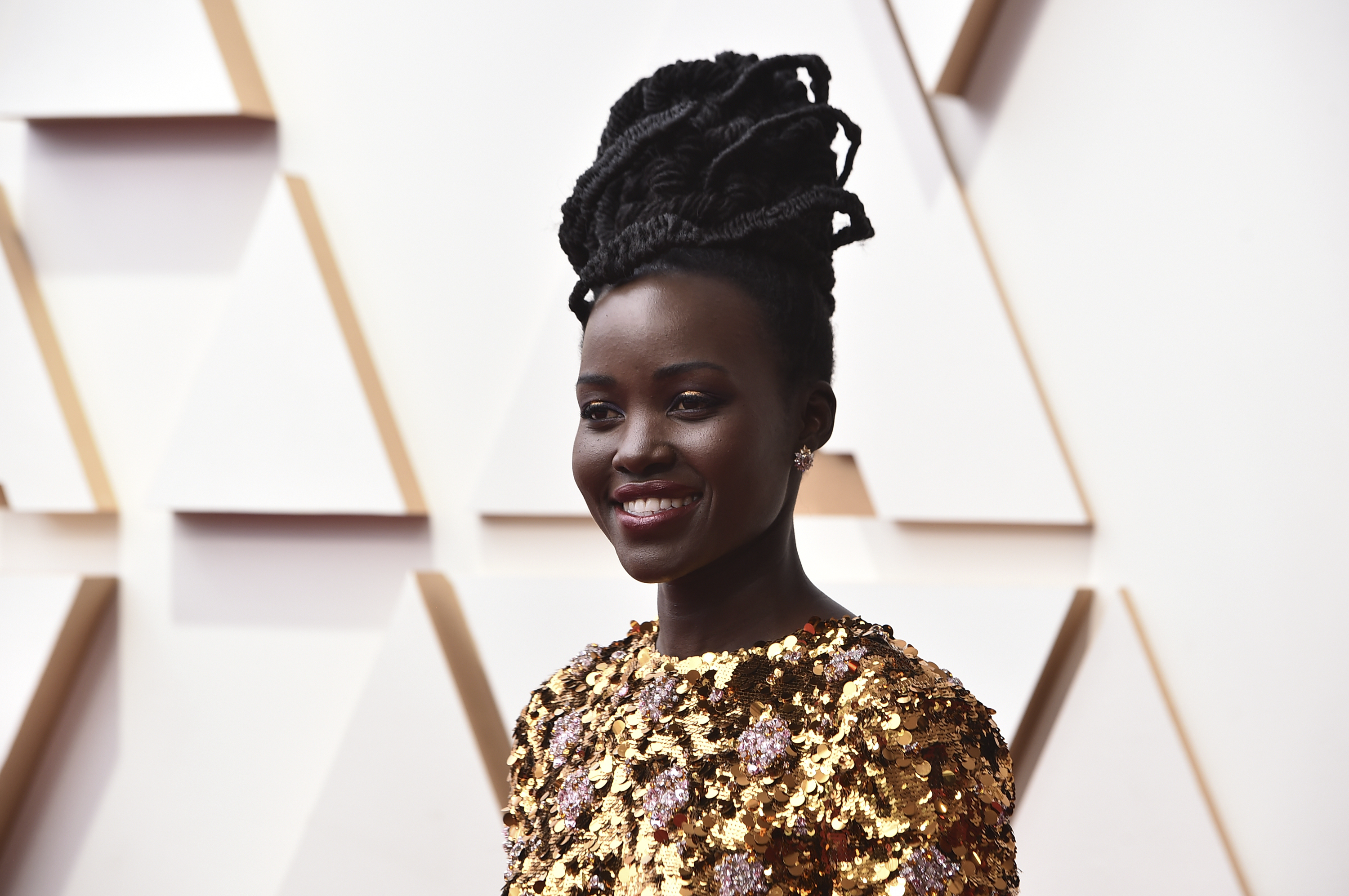 Lupita Nyong'o arrives at the Oscars on Sunday, March 27, 2022, at the Dolby Theatre in Los Angeles. (Photo by Jordan Strauss/Invision/AP)