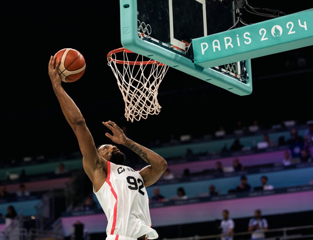 epa11508971 Khem Birch of Canada in action during the Men's Group A match between Australia and Canada in the Paris 2024 Olympic Games, at the Pierre Mauroy Stadium in Villeneuve-d'Ascq, France, 30 July 2024.  EPA-EFE/ALEX PLAVEVSKI