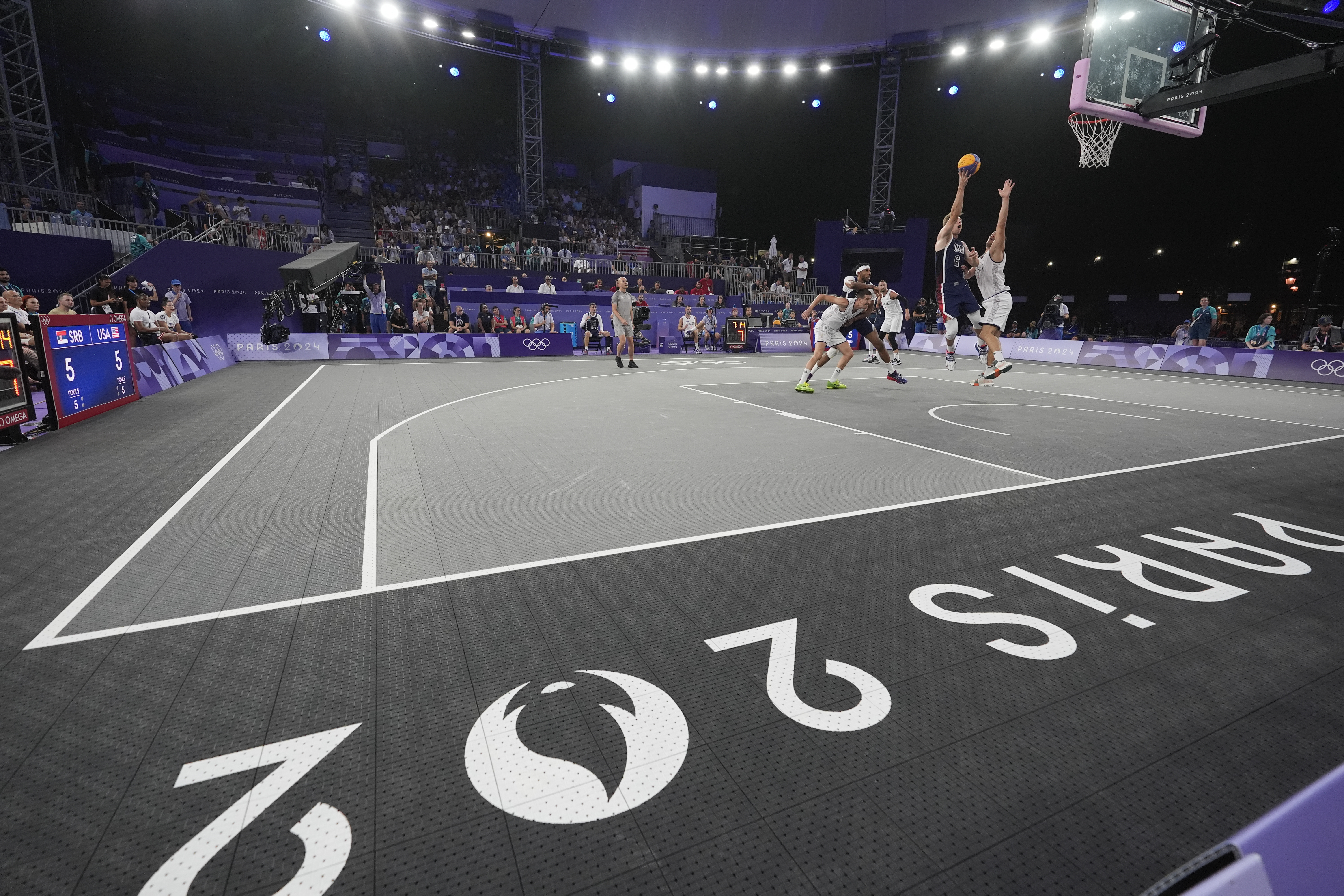 Canyon Barry of the United States shoots in the men's 3x3 basketball pool round match between Serbia and the United States at the 2024 Summer Olympics, Tuesday, July 30, 2024, in Paris, France. (AP Photo/Rebecca Blackwell)