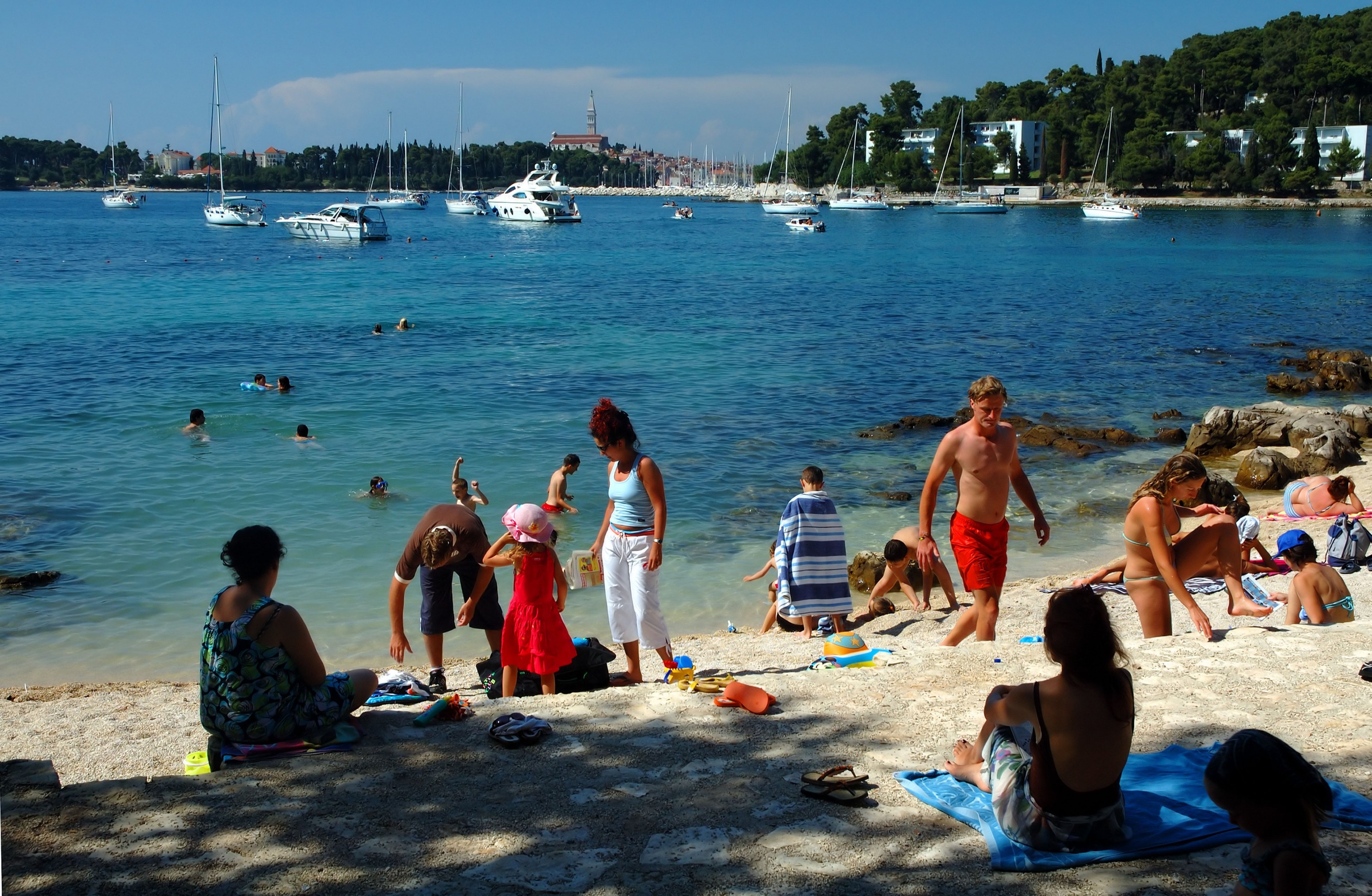 Tourists on a beach in the Punta Corrente Forest Park, Rovinj, Croatia, Mediterranean Sea, Adriatic Sea