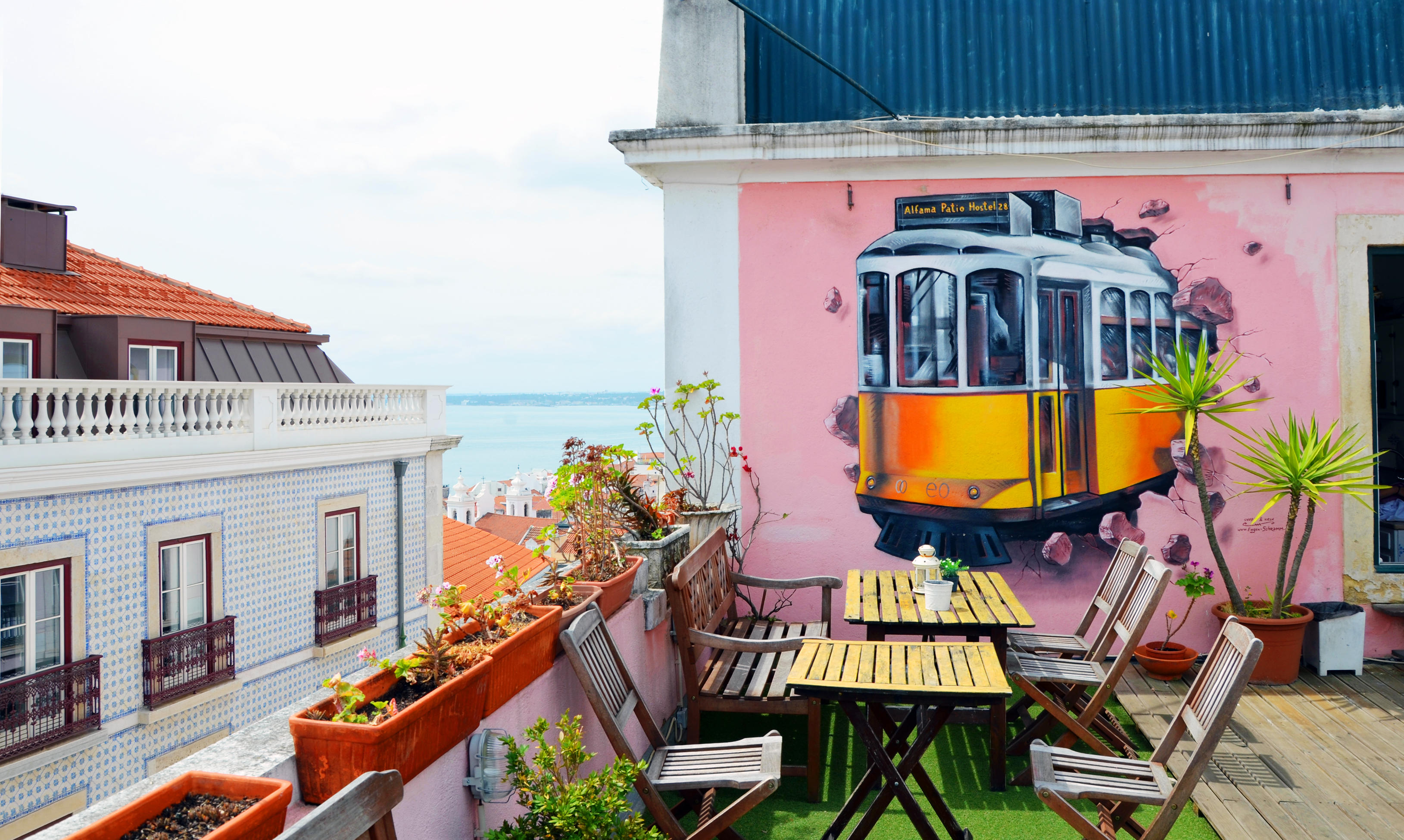 Lisbon, Portugal - 4th May 2017: Wall painting of famous yellow Tram 28 in Alfama District, Lisbon, Portugal