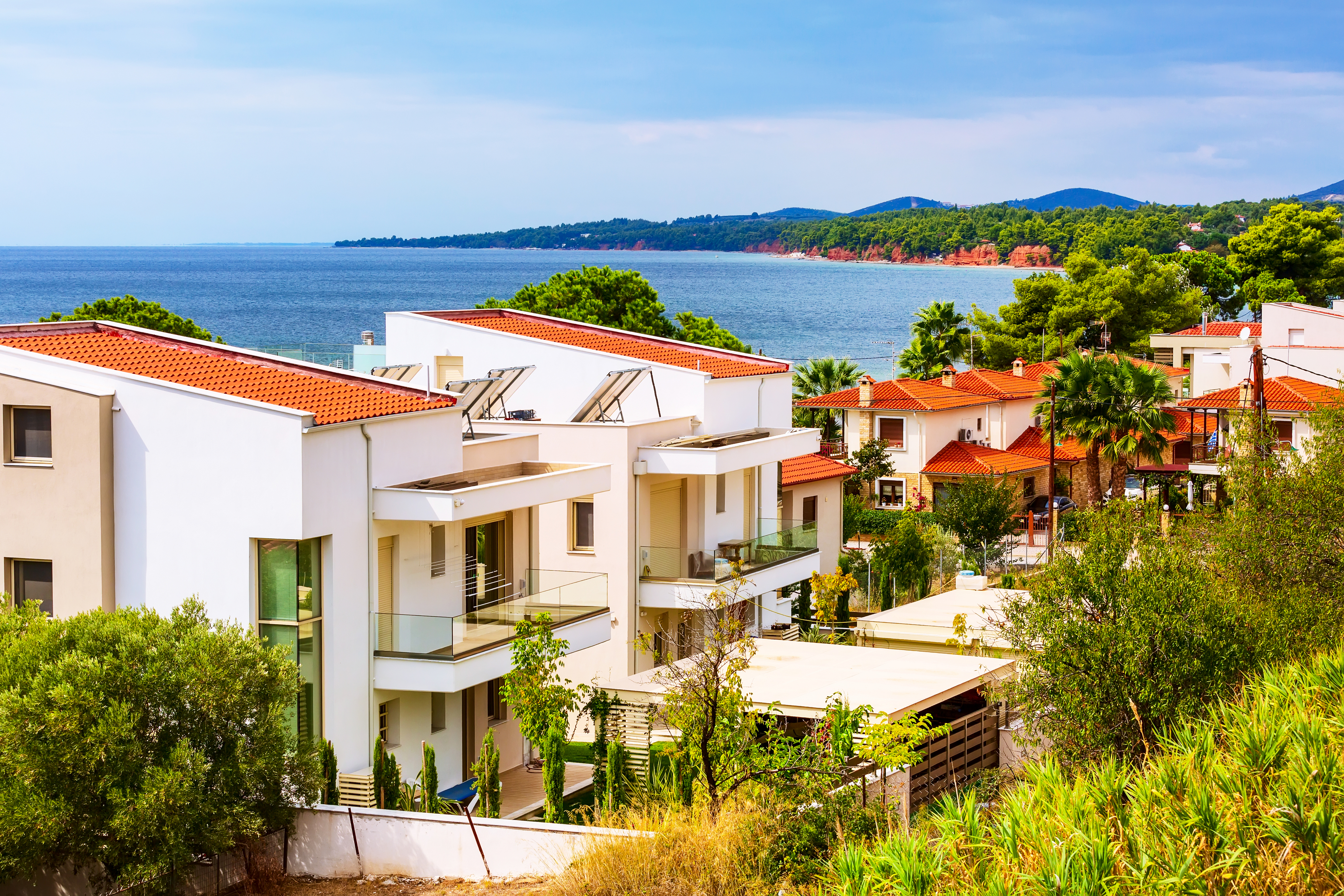 Nikiti, Sithonia, Chalkidiki Peninsula, Greece panorama with houses, blue sea and red rocks mountains,Image: 832521984, License: Royalty-free, Restrictions: , Model Release: no, Credit line: Nataliya_Nazarova{} / imageBROKER / Profimedia