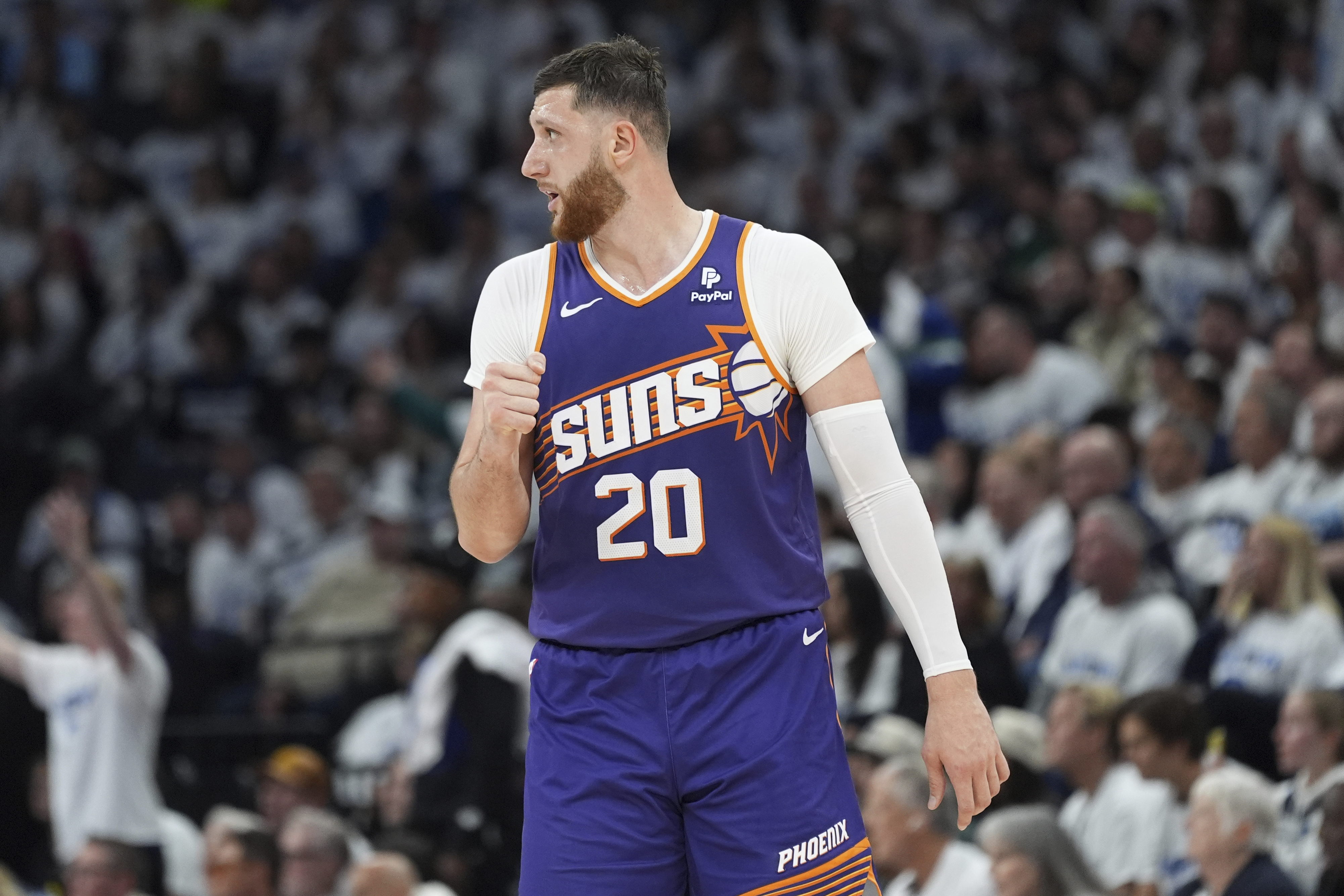 Phoenix Suns center Jusuf Nurkic (20) pumps his fist during the first half of Game 1 of an NBA basketball first-round playoff series against the Minnesota Timberwolves, Saturday, April 20, 2024, in Minneapolis. (AP Photo/Abbie Parr)