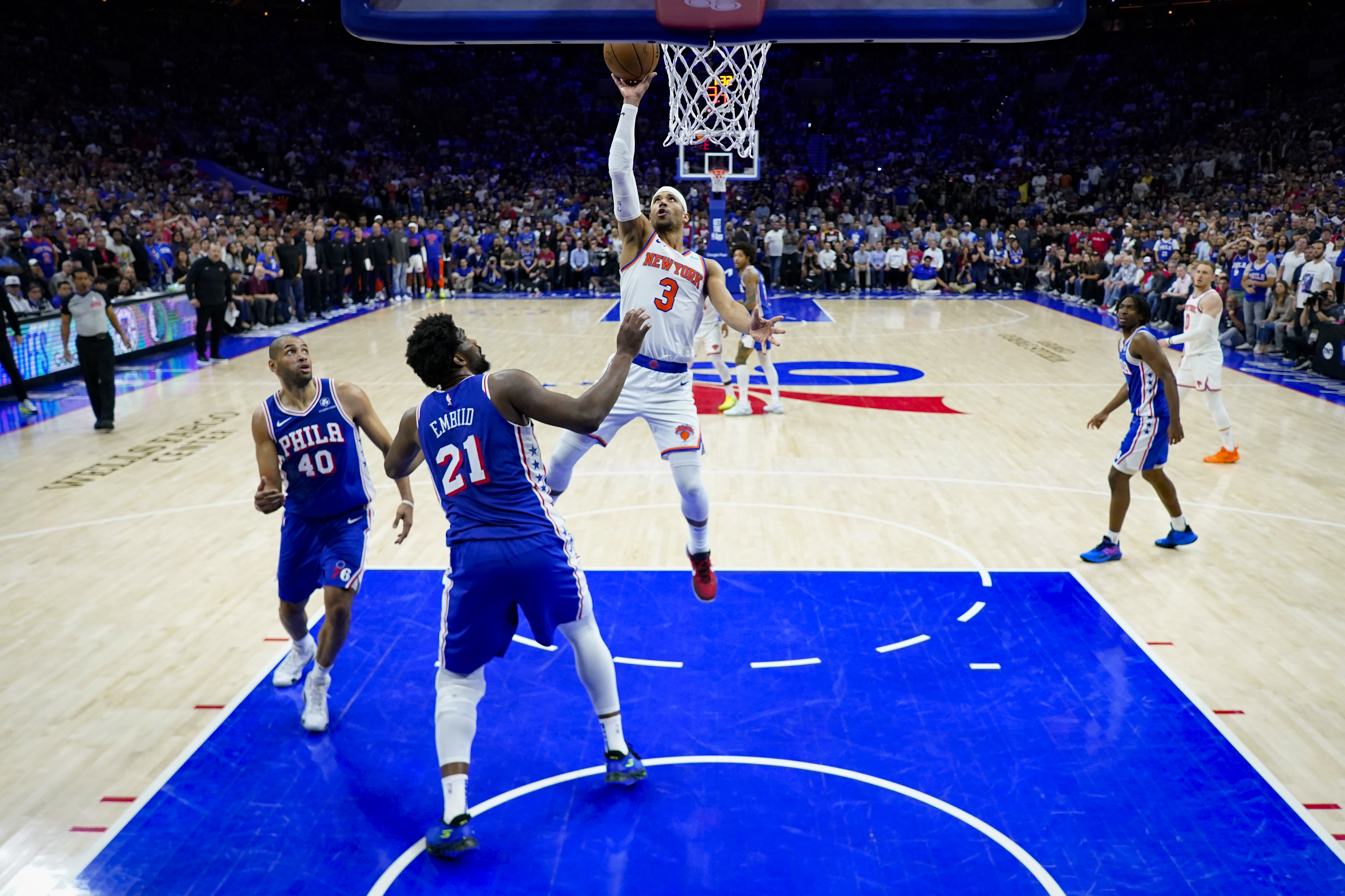 New York Knicks' Josh Hart (3) goes up to shoot against Philadelphia 76ers' Joel Embiid (21) during the second half of Game 6 in an NBA basketball first-round playoff series, Thursday, May 2, 2024, in Philadelphia. (AP Photo/Matt Slocum)