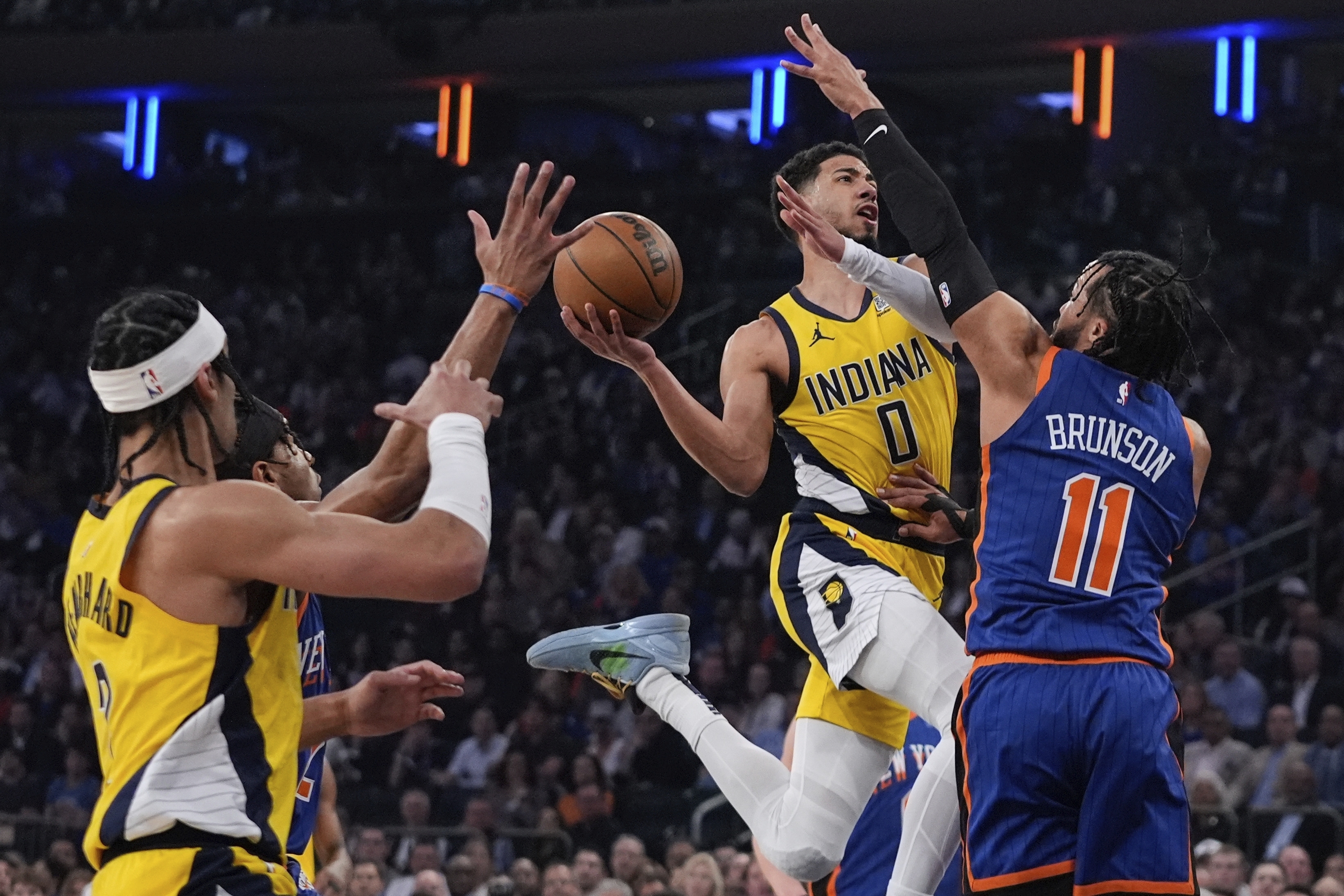 Indiana Pacers' Tyrese Haliburton (0) drives past New York Knicks' Jalen Brunson (11) during the first half of Game 5 in an NBA basketball second-round playoff series, Tuesday, May 14, 2024, in New York. (AP Photo/Frank Franklin II)