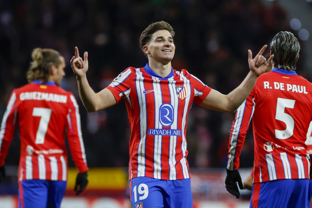 epa11770933 Atletico Madrid's Julian Alvarez (C) celebrates after scoring the 1-0 goal during the UEFA Champions League soccer match between Atletico Madrid and Slovan Bratislava, in Madrid, Spain, 11 December 2024.  EPA-EFE/JUANJO MARTIN