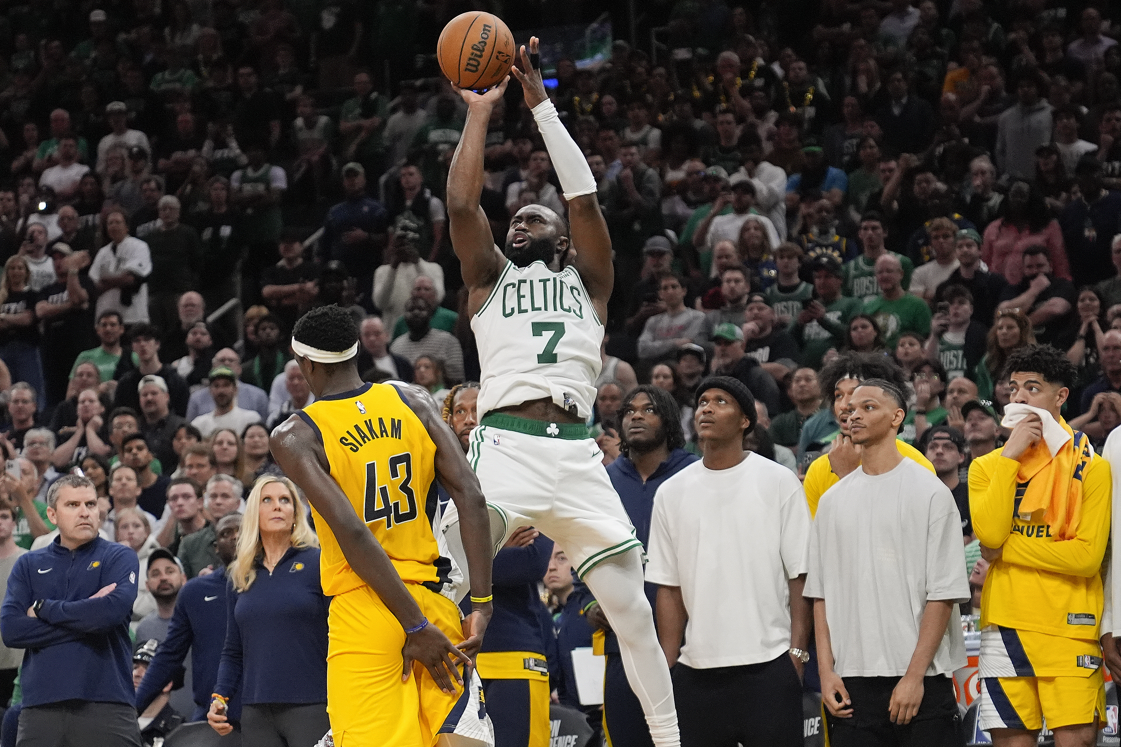 Boston Celtics guard Jaylen Brown (7) puts up a 3-point shot to score and tie the game against the Indiana Pacers with seconds left in Game 1 of the NBA Eastern Conference basketball finals, Tuesday, May 21, 2024, in Boston. (AP Photo/Charles Krupa)