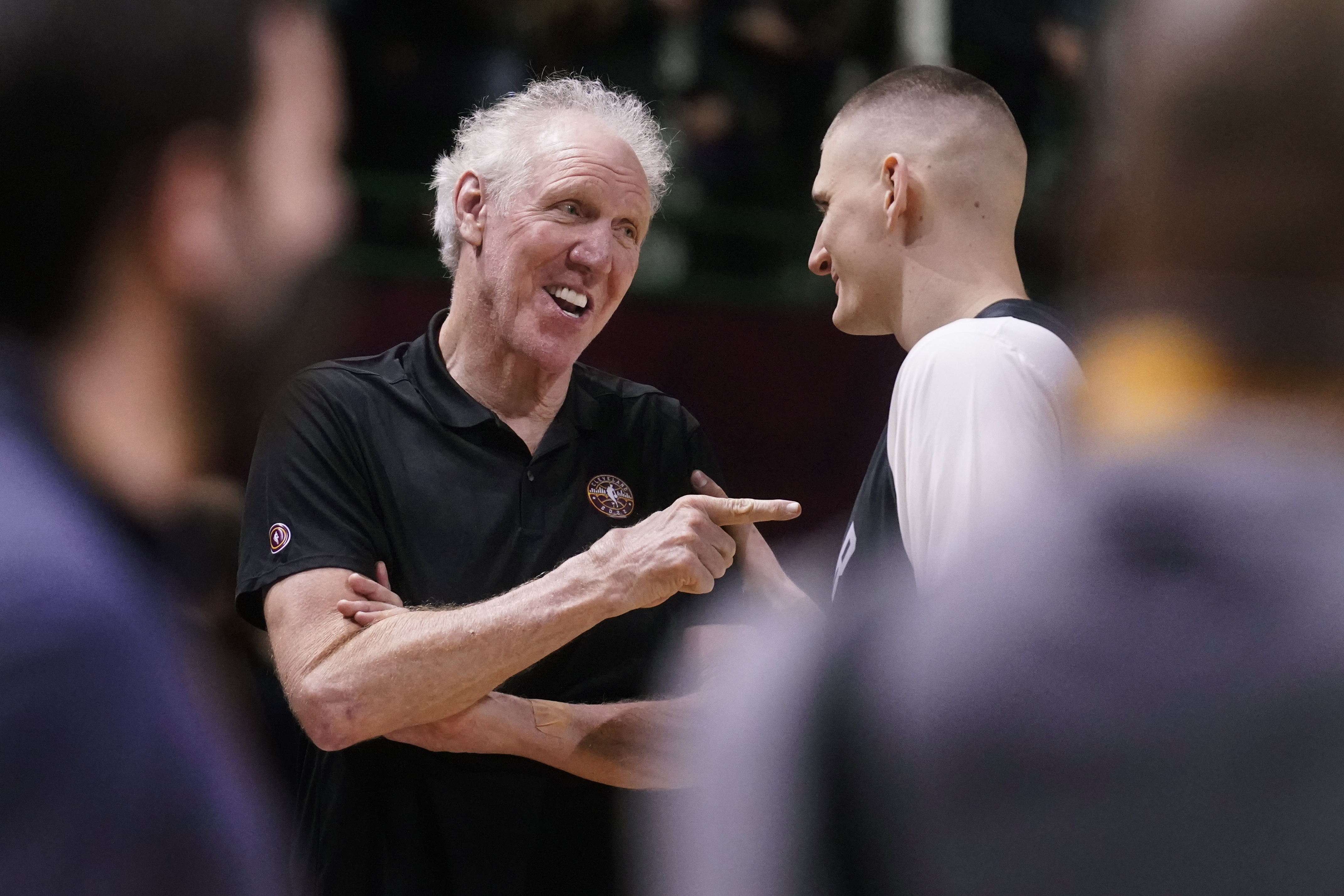 Basketball Hall of Fame legend Bill Walton, left, jokes with Denver Nuggets center Nikola Jokic during a practice session for the NBA All-Star basketball game in Cleveland, Saturday, Feb. 19, 2022. (AP Photo/Charles Krupa)