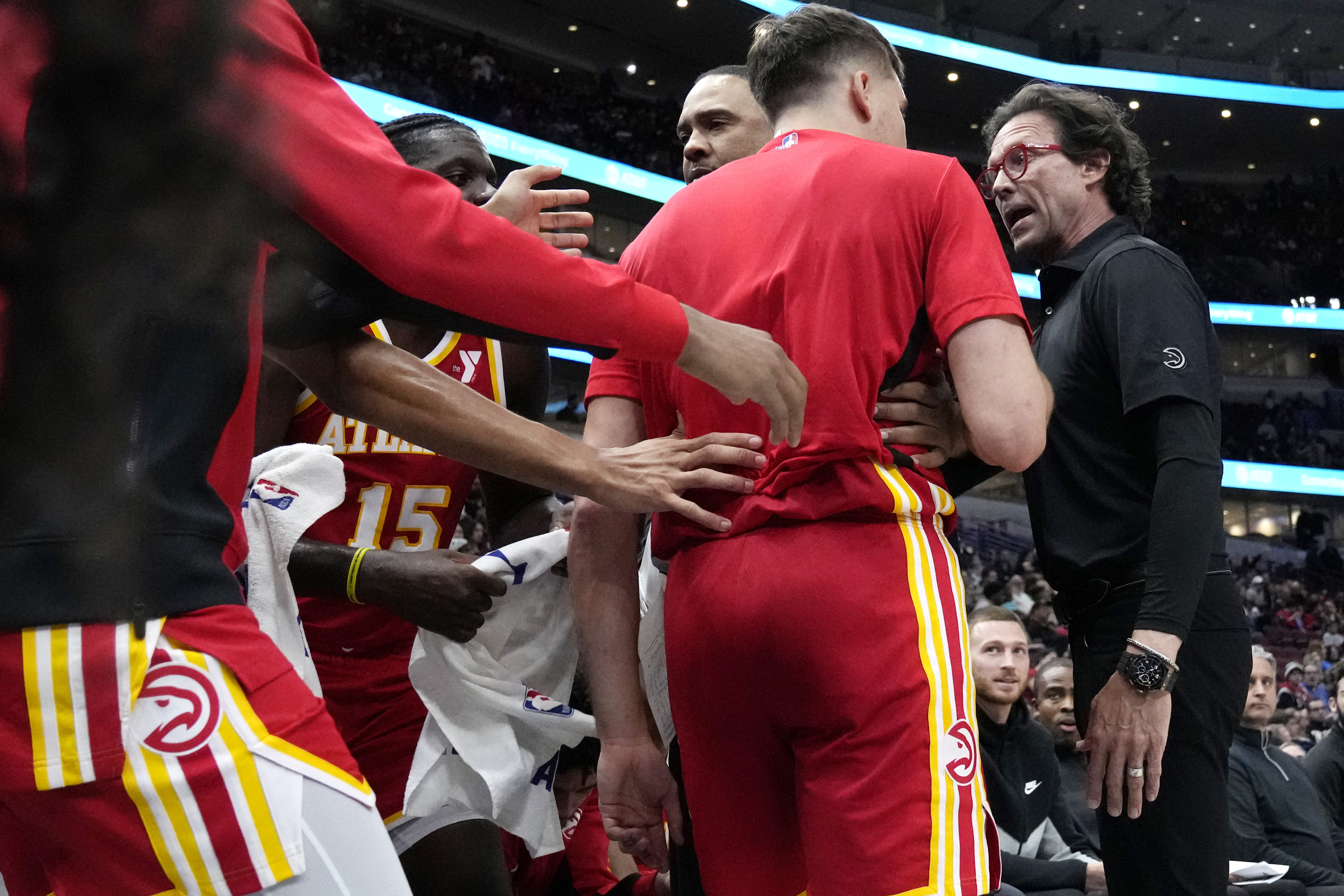 Atlanta Hawks head coach Quin Snyder, right, talks to guard Bogdan Bogdanovic during the second half of an NBA basketball game against the Chicago Bulls in Chicago, Monday, April 1, 2024. (AP Photo/Nam Y. Huh)