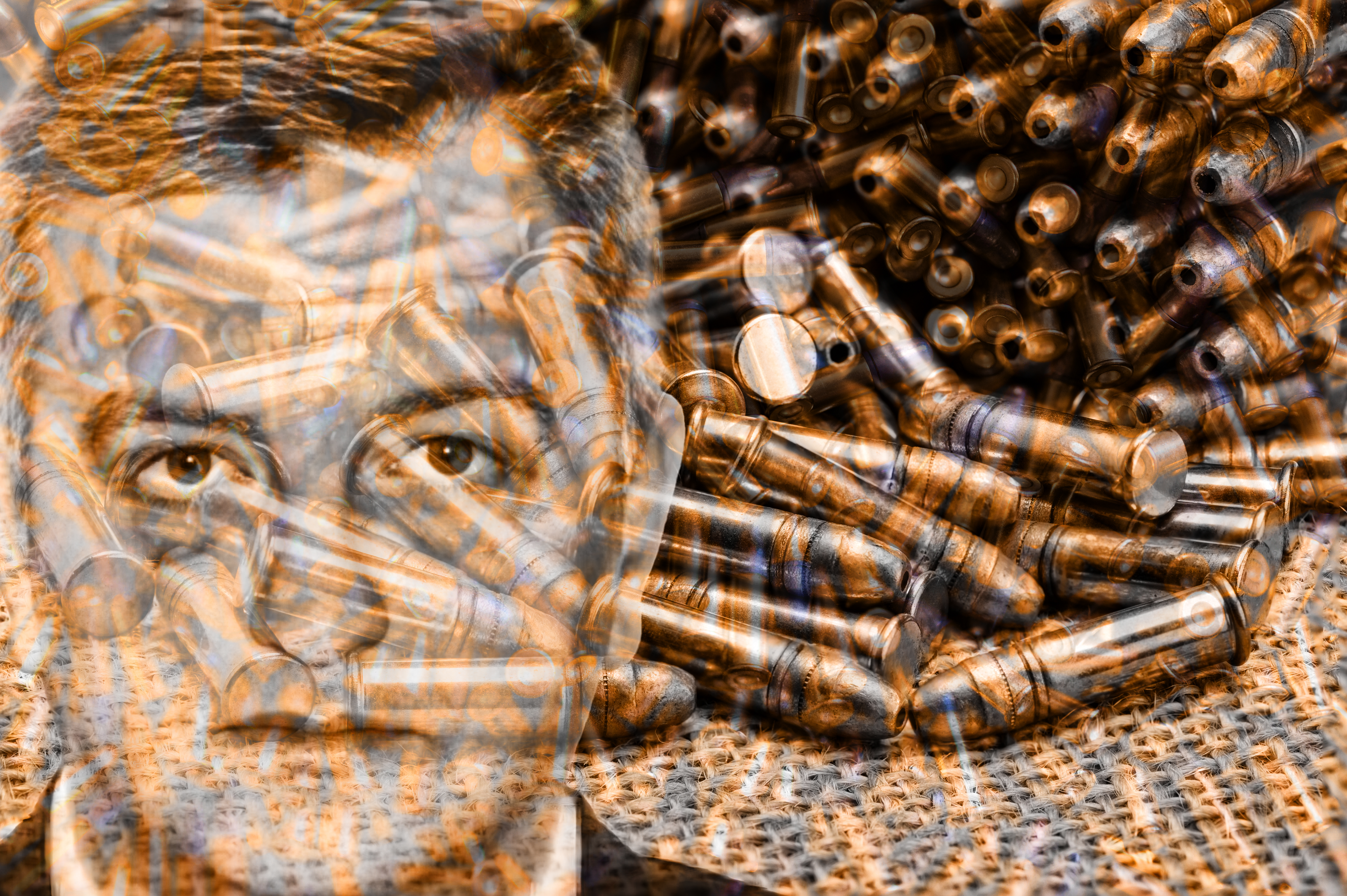 Heap,Of,Black,And,Golden,Small-caliber,Bullets,On,Table