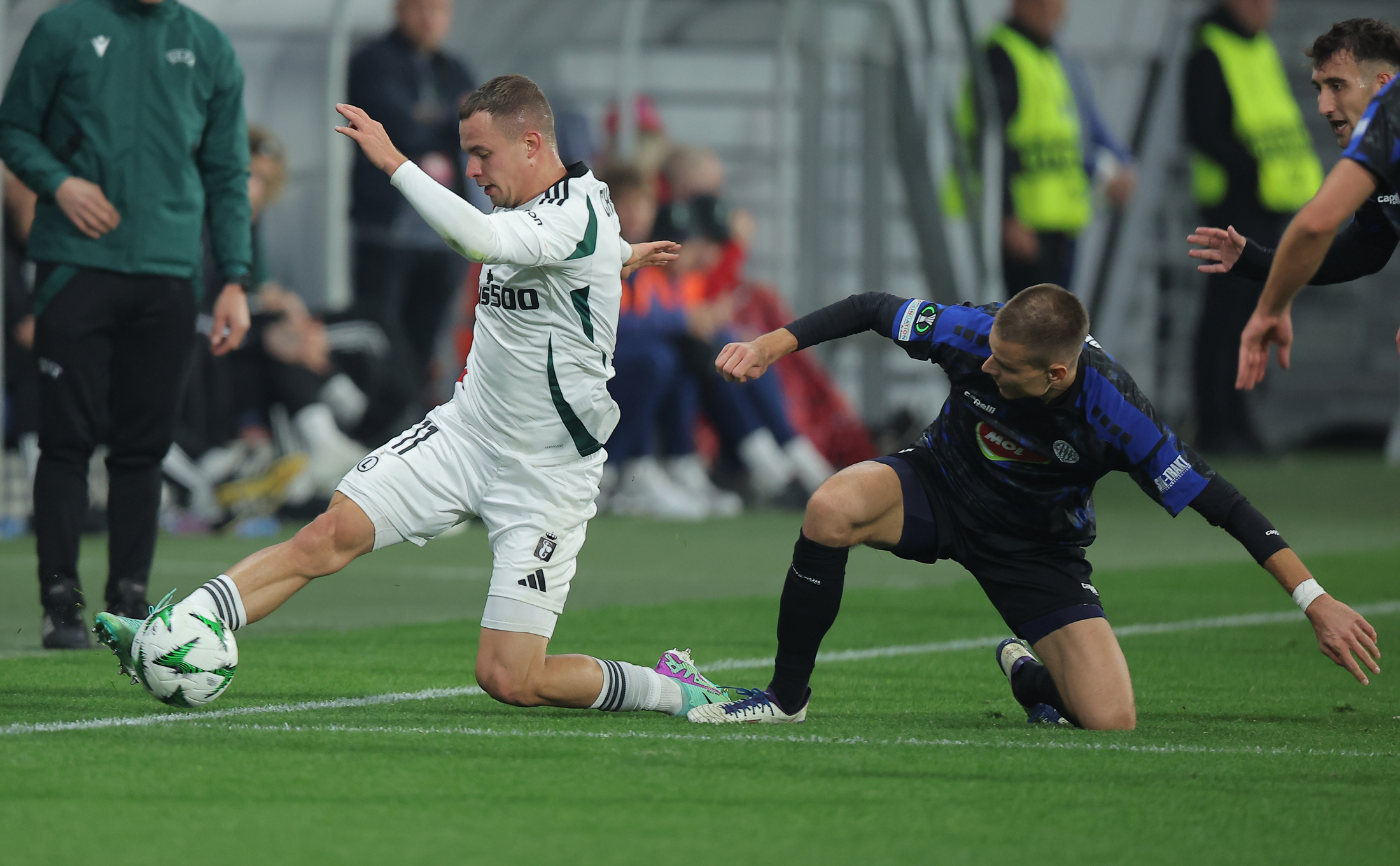 Legia's Kacper Chodyna (L) in action during UEFA Conference League football match between TSC and Legia Warszava in Backa Topola, Serbia on Oct. 24. 2024.