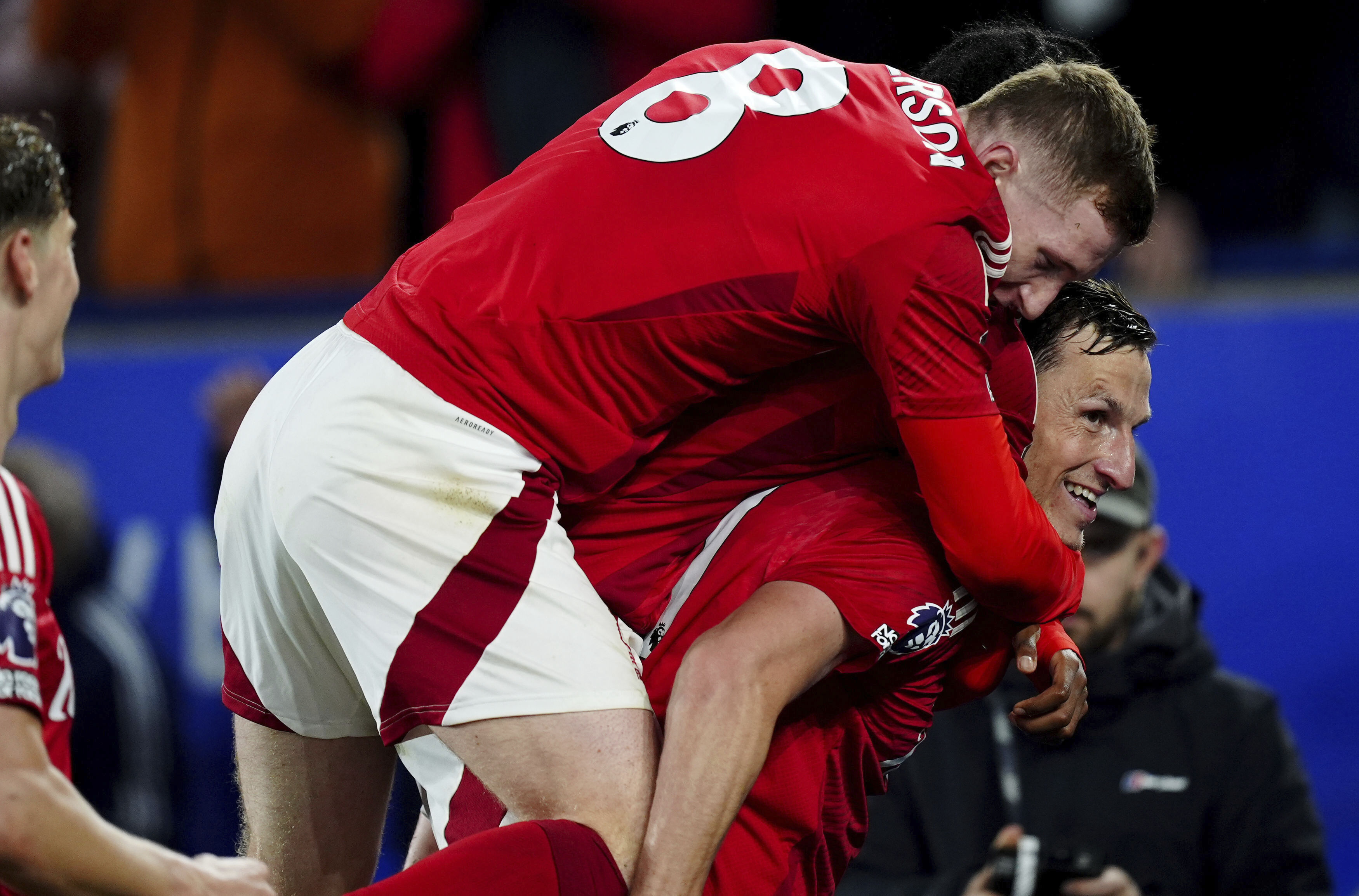 Nottingham Forest's Chris Wood, right, celebrates scoring their side's second goal of the game during the Premier League match at the King Power Stadium, in Leicester, England, Friday Oct. 25, 2024. (Mike Egerton/PA via AP)