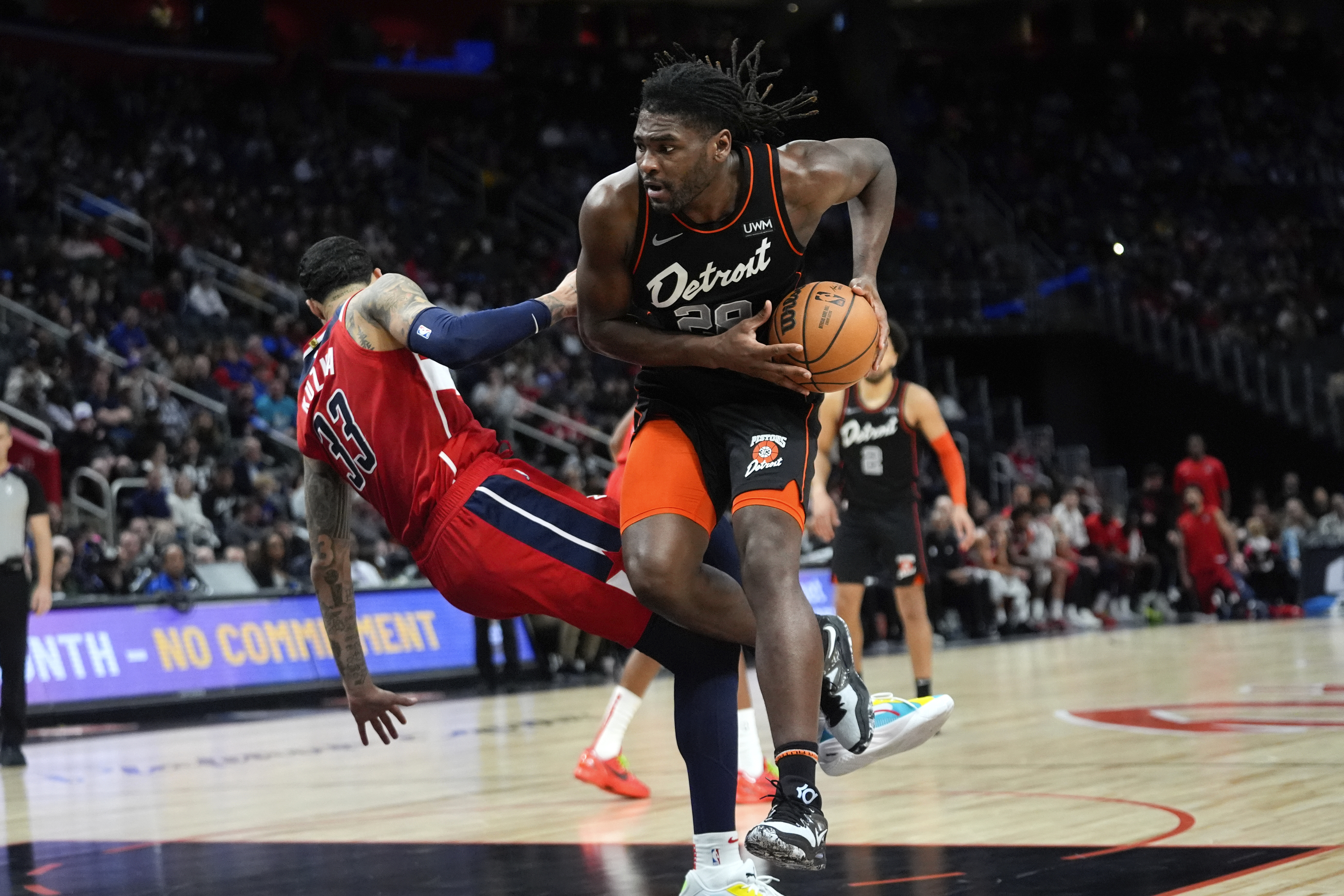 Detroit Pistons center Isaiah Stewart (28) drives on Washington Wizards forward Kyle Kuzma (33) in the first half of an NBA basketball game in Detroit, Saturday, Jan. 27, 2024. (AP Photo/Paul Sancya)