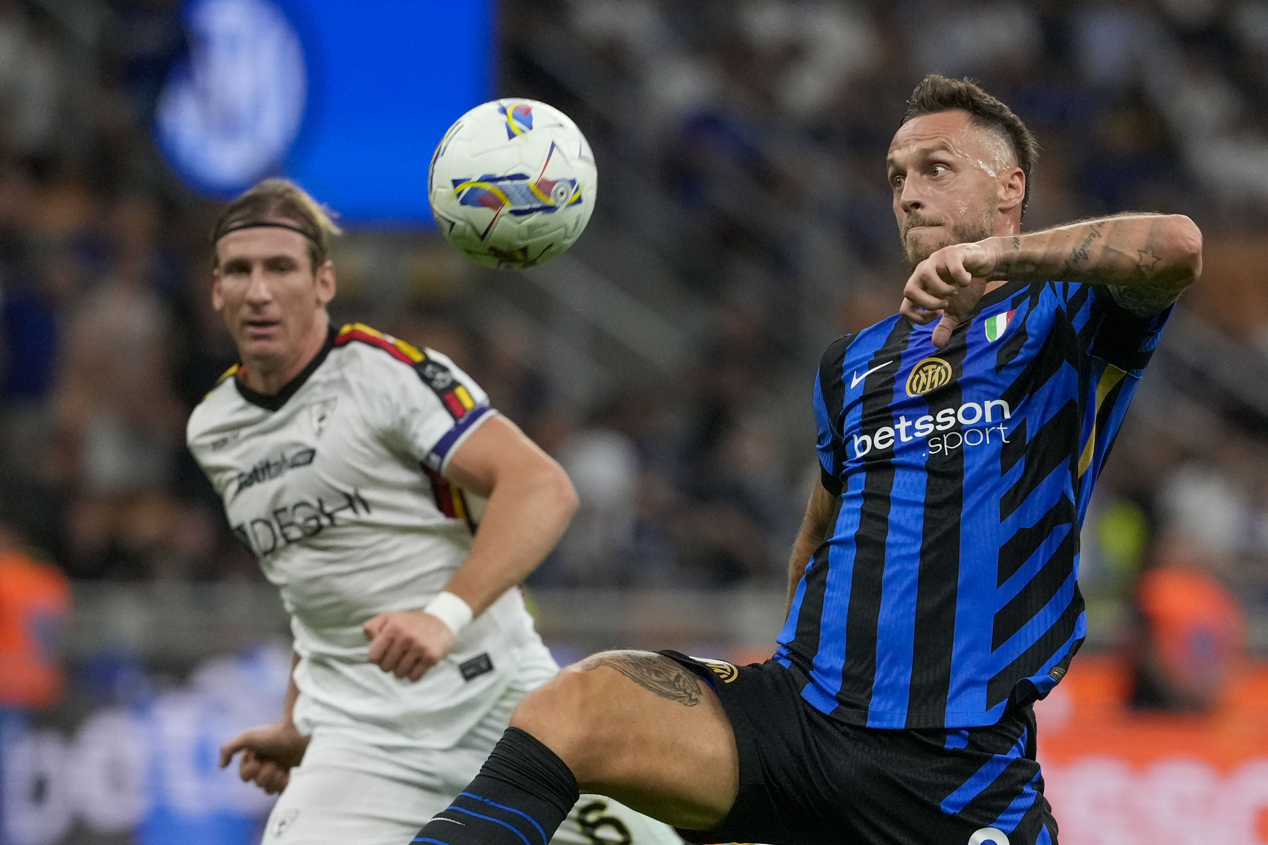 Inter Milan's Marko Arnautovic kicks the ball during a Serie A soccer match between Inter Milan and Lecce, at the San Siro stadium in Milan, Italy, Saturday, Aug. 24, 2024. (AP Photo/Luca Bruno)