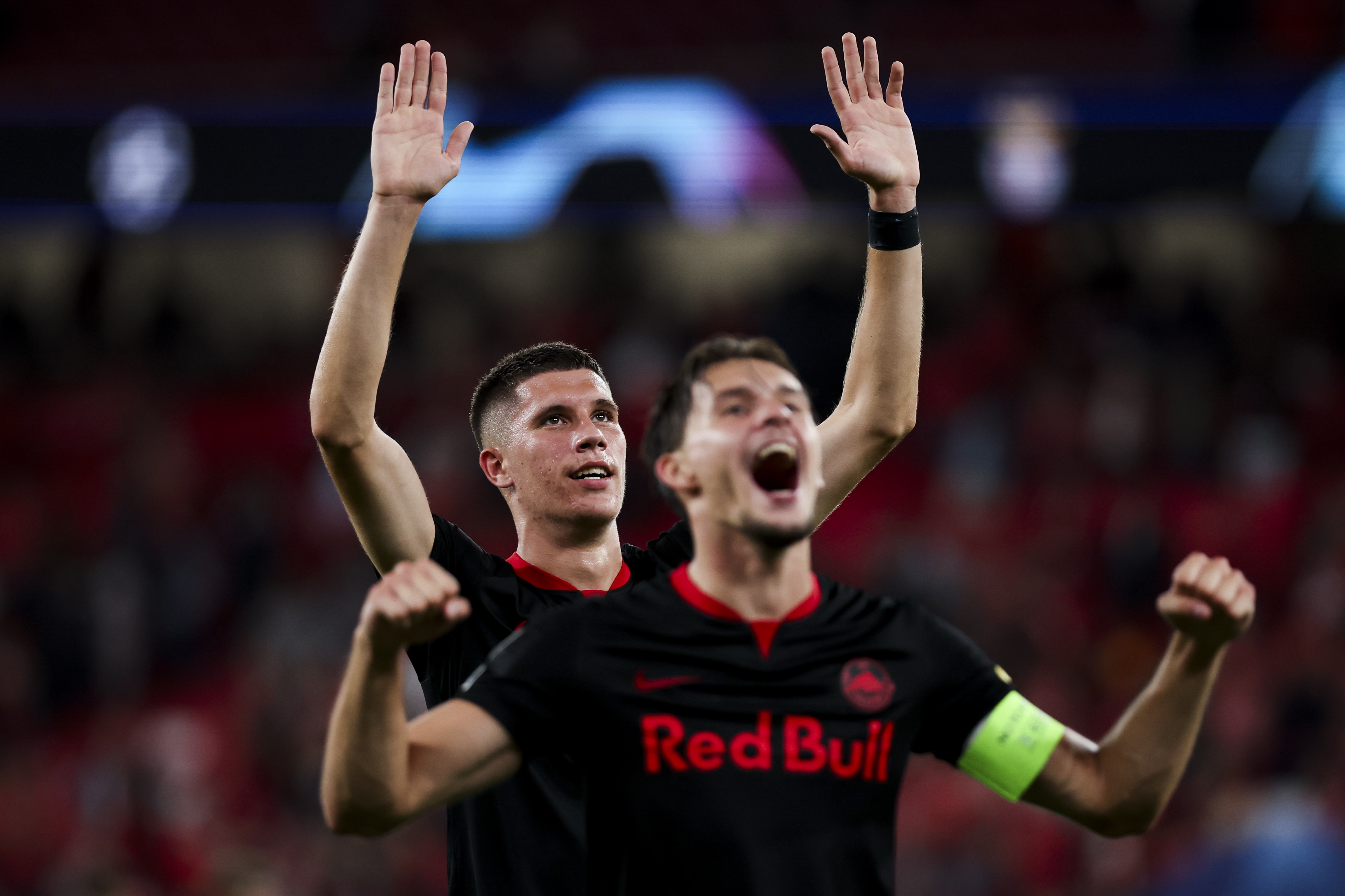 epa10873198 RB Salzburg players Petar Ratkov (L) and Amar Dedic celebrate after winning the UEFA Champions League group D soccer match between Benfica SL and RB Salzburg at Luz Stadium in Lisbon, Portugal, 20 September 2023.  EPA-EFE/JOSE SENA GOULAO