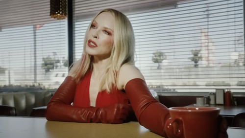 Kylie Minogue goes red hot for new music video