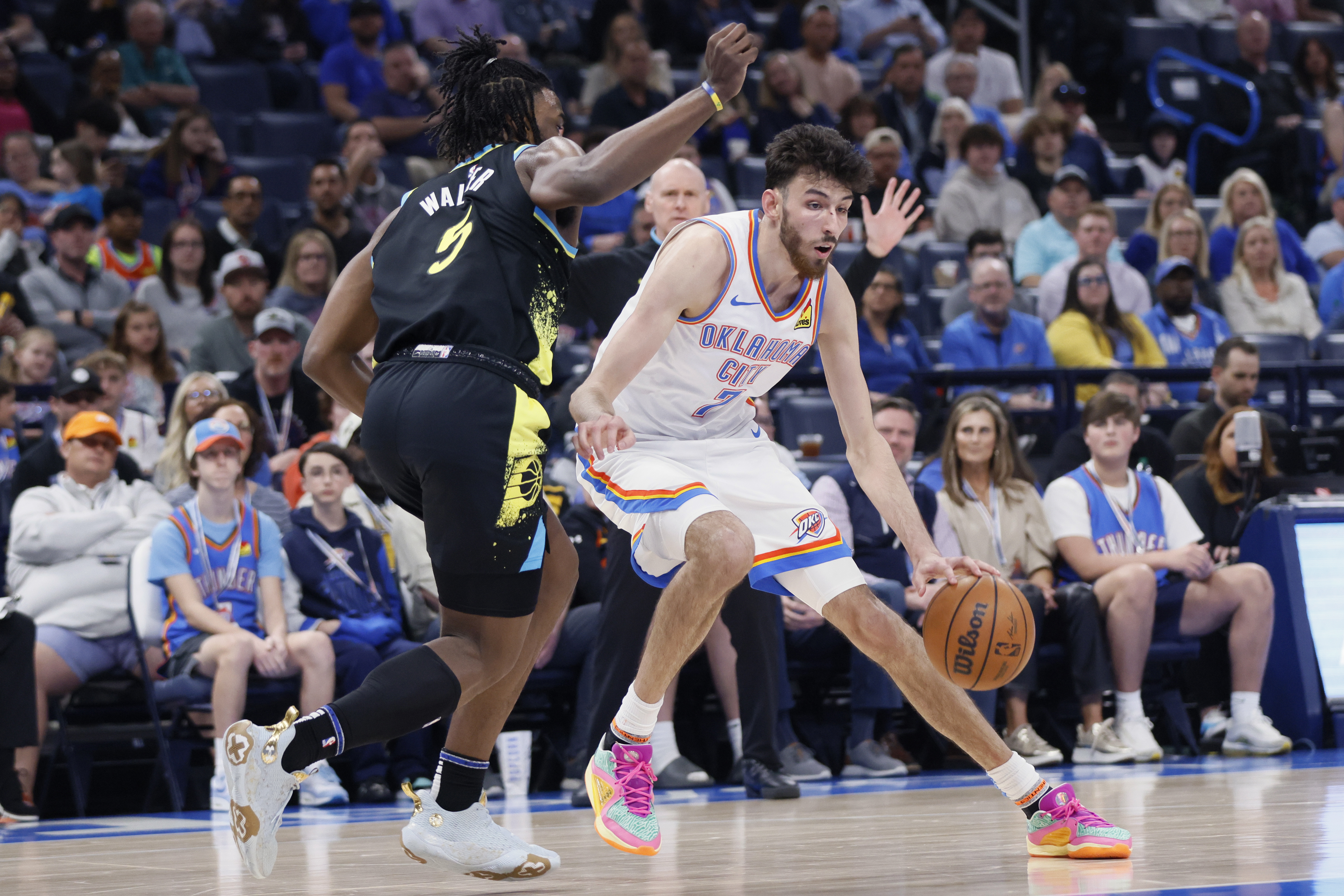 Oklahoma City Thunder forward Chet Holmgren, right, drives against Indiana Pacers forward Jarace Walker, left, during the first half of an NBA basketball game Tuesday, March 12, 2024, in Oklahoma City. (AP Photo/Nate Billings)