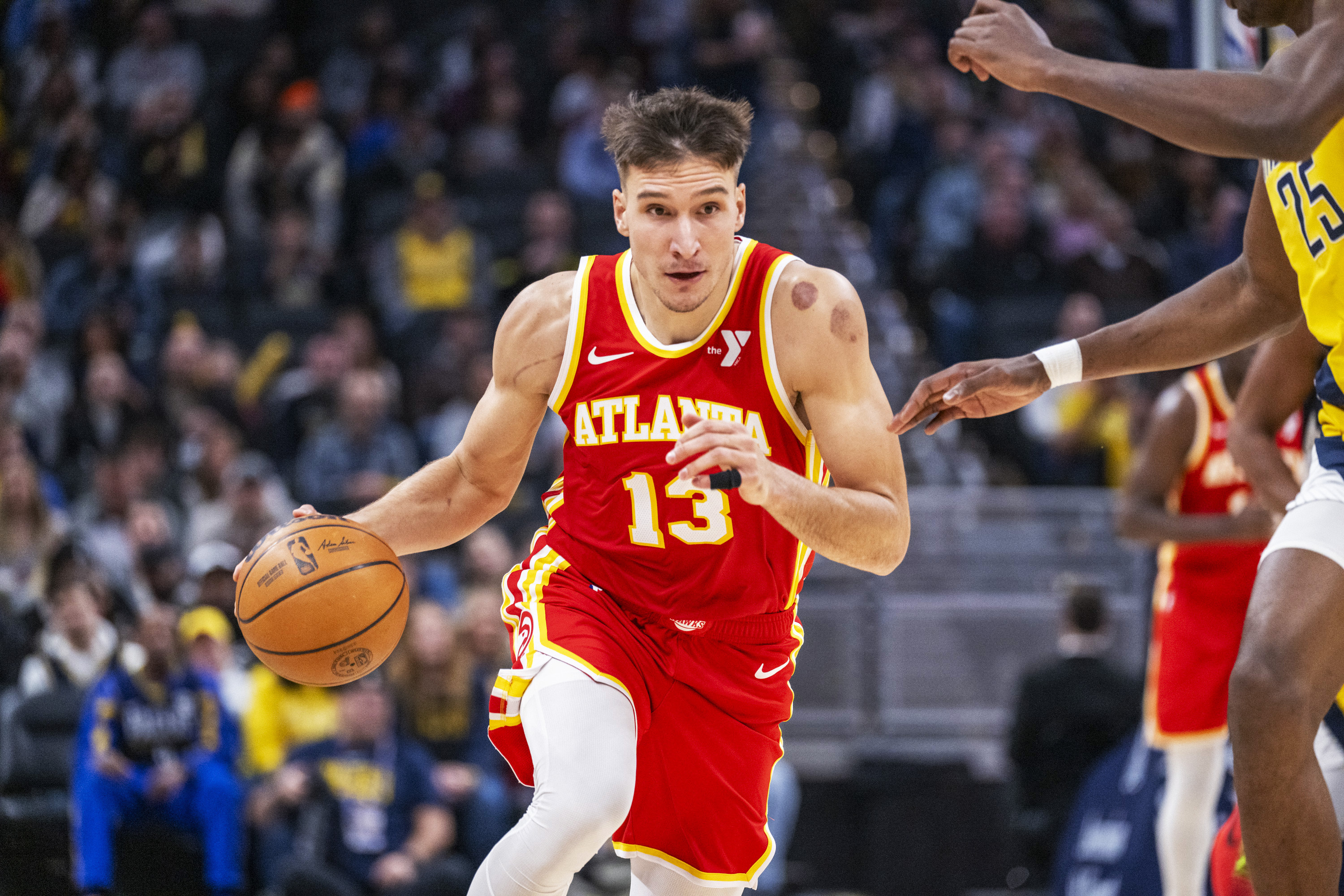 Atlanta Hawks guard Bogdan Bogdanovic (13) drives toward the basket during the first half of the team's NBA basketball game against the Indiana Pacers in Indianapolis, Friday, Jan. 5, 2024. (AP Photo/Doug McSchooler)