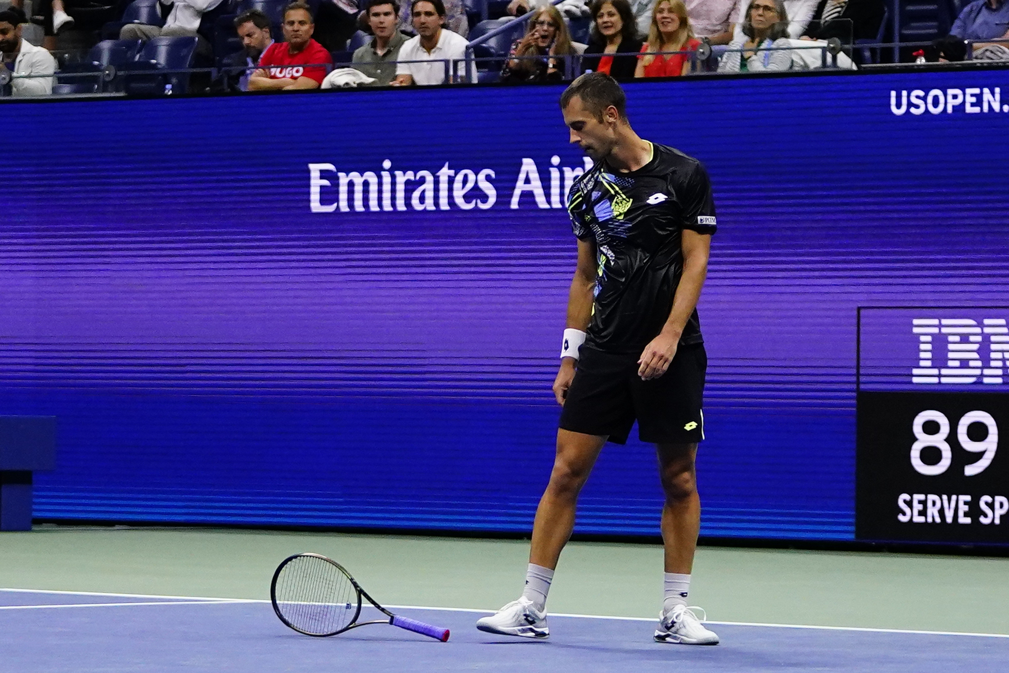 Laslo Djere, of Serbia, drops his racket after missing a shot during a match against Novak Djokovic, of Serbia, during the third round of the U.S. Open tennis championships, Saturday, Sept. 2, 2023, in New York. (AP Photo/Frank Franklin II)
