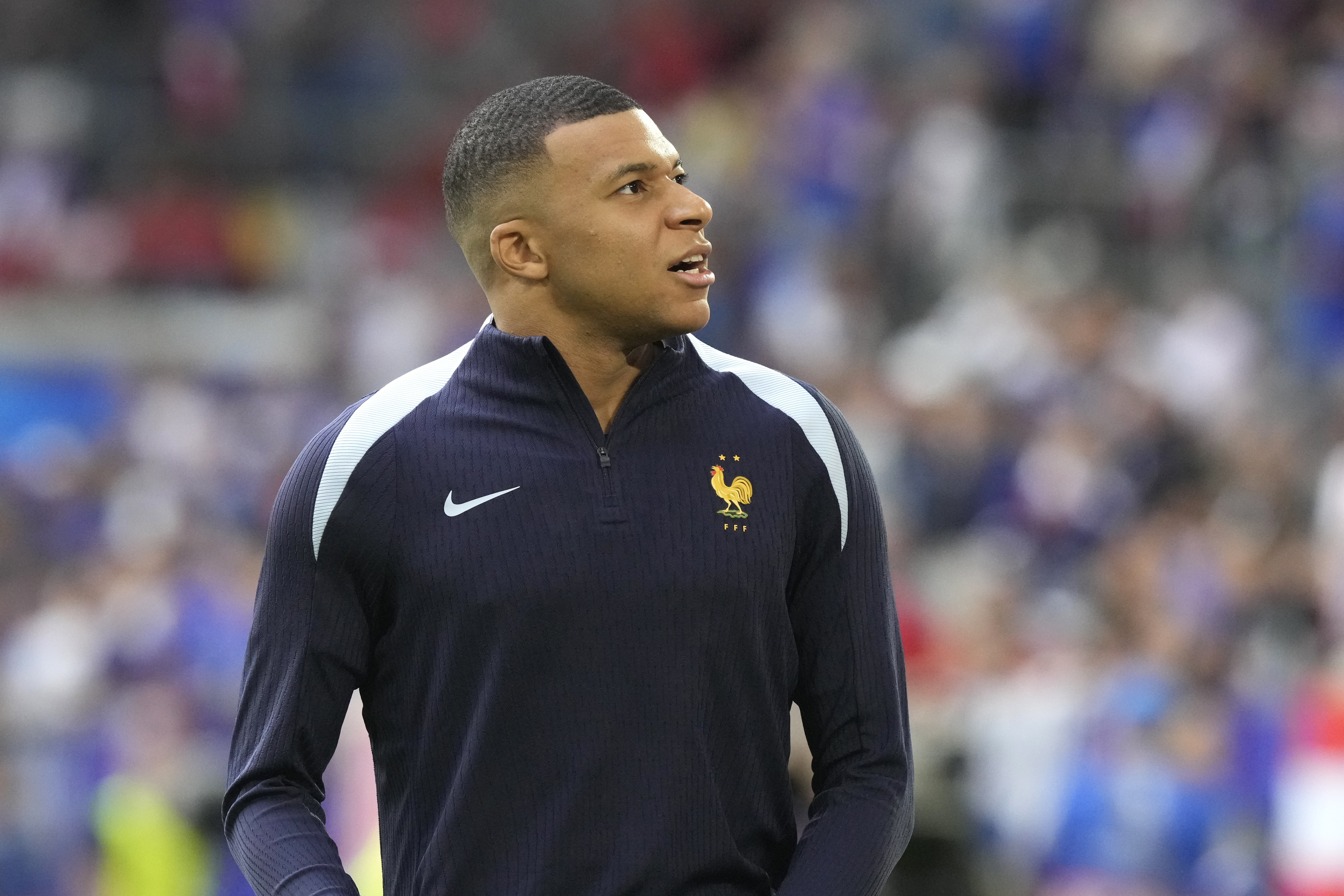 Kylian Mbappe of France warms up ahead of a Group D match between Austria and France at the Euro 2024 soccer tournament in Duesseldorf, Germany, Monday, June 17, 2024. (AP Photo/Frank Augstein)