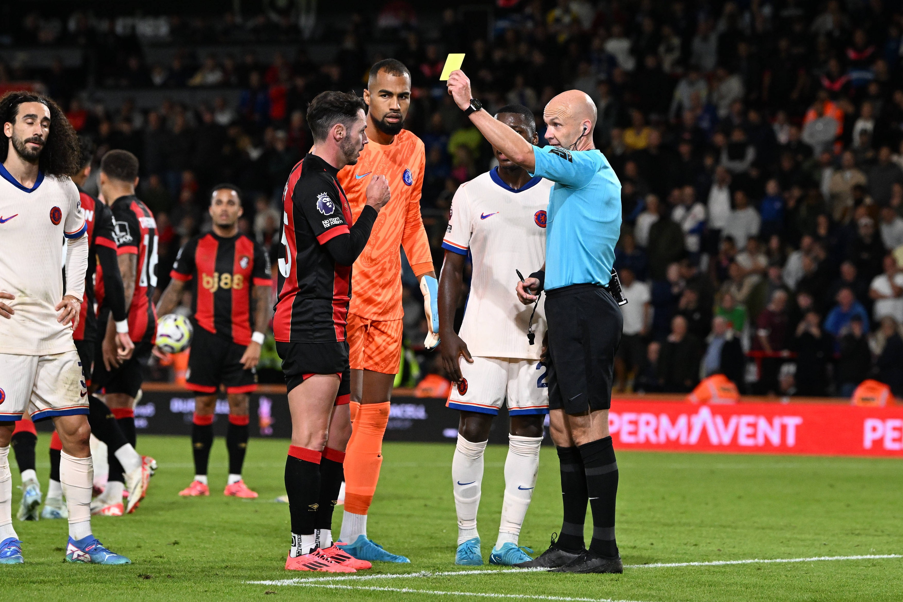 Bournemouth v Chelsea Premier League 14/09/2024. Adam Smith (15) of AFC Bournemouth is shown a yellow card, booked by re