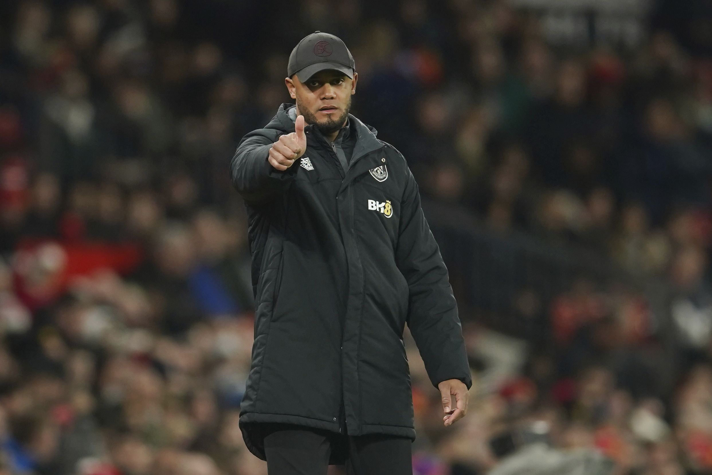 Burnley's manager Vincent Kompany gestures to his players during the English League Cup 4th round soccer match between Manchester United and Burnley, at Old Trafford in Manchester, England Wednesday, Dec. 21, 2022. (AP Photo/Dave Thompson)
