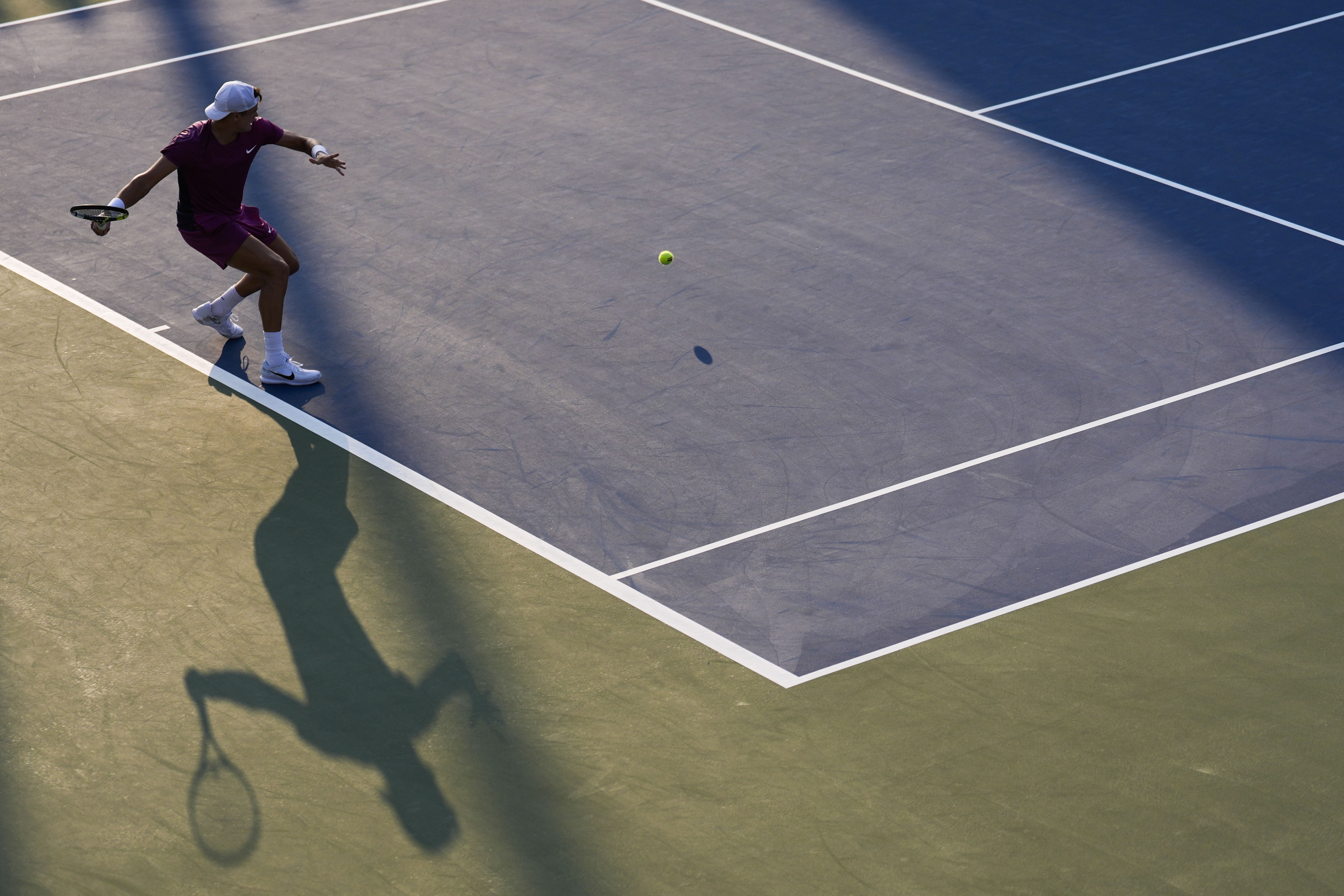 Brandon Nakashima, of the United States, returns a shot to Holger Rune, of Denmark, during a first round match of the U.S. Open tennis championships, Monday, Aug. 26, 2024, in New York. (AP Photo/Matt Rourke)