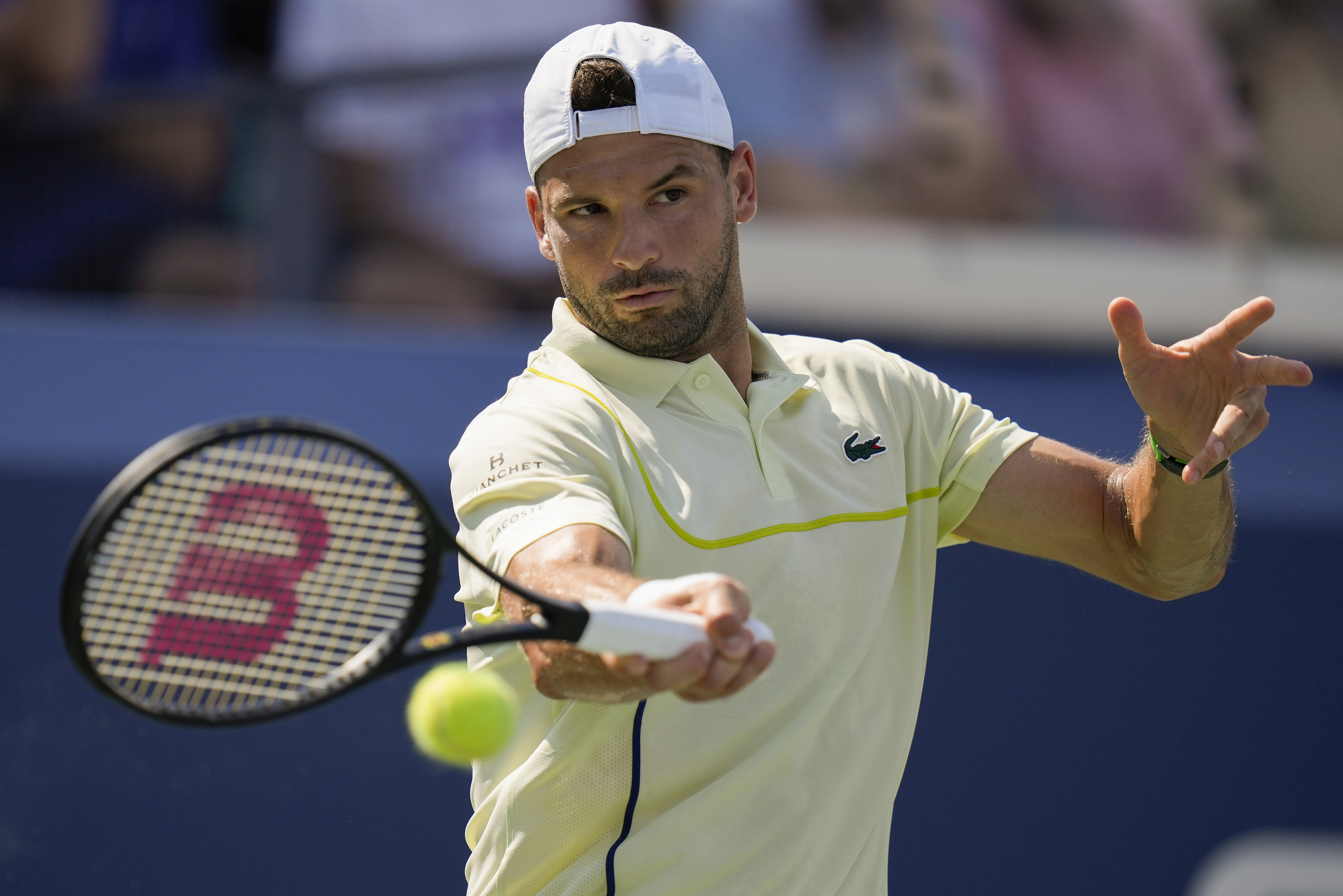 Grigor Dimitrov, of Bulgaria, returns a shot to Ricky Hijikata, of Australia, during the first round of the U.S. Open tennis championships, Wednesday, Aug. 28, 2024, in New York. (AP Photo/Seth Wenig)