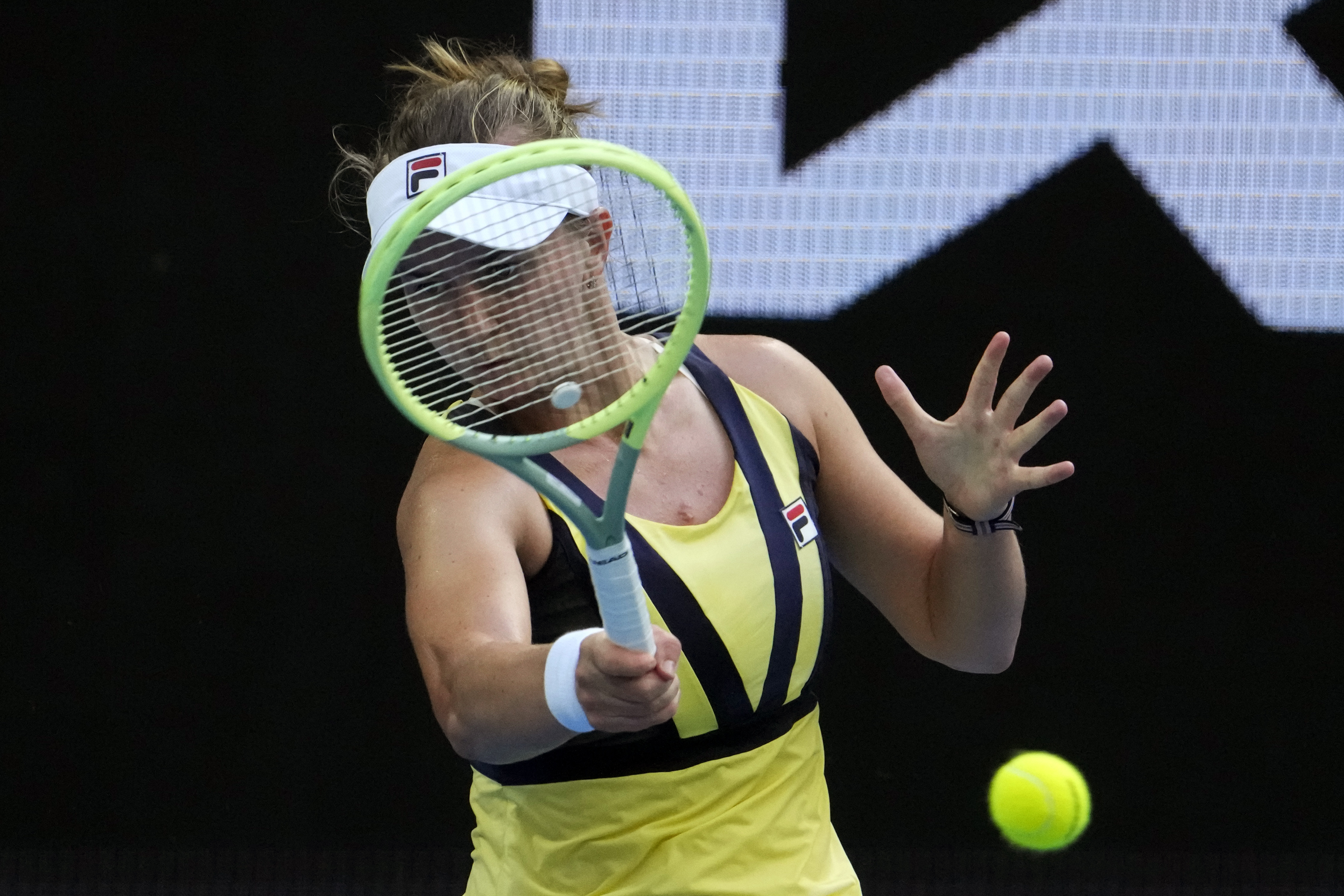 Barbora Krejcikova of the Czech Republic plays a forehand return to Jessica Pegula of the U.S. during their fourth round match at the Australian Open tennis championship in Melbourne, Australia, Sunday, Jan. 22, 2023. (AP Photo/Ng Han Guan)