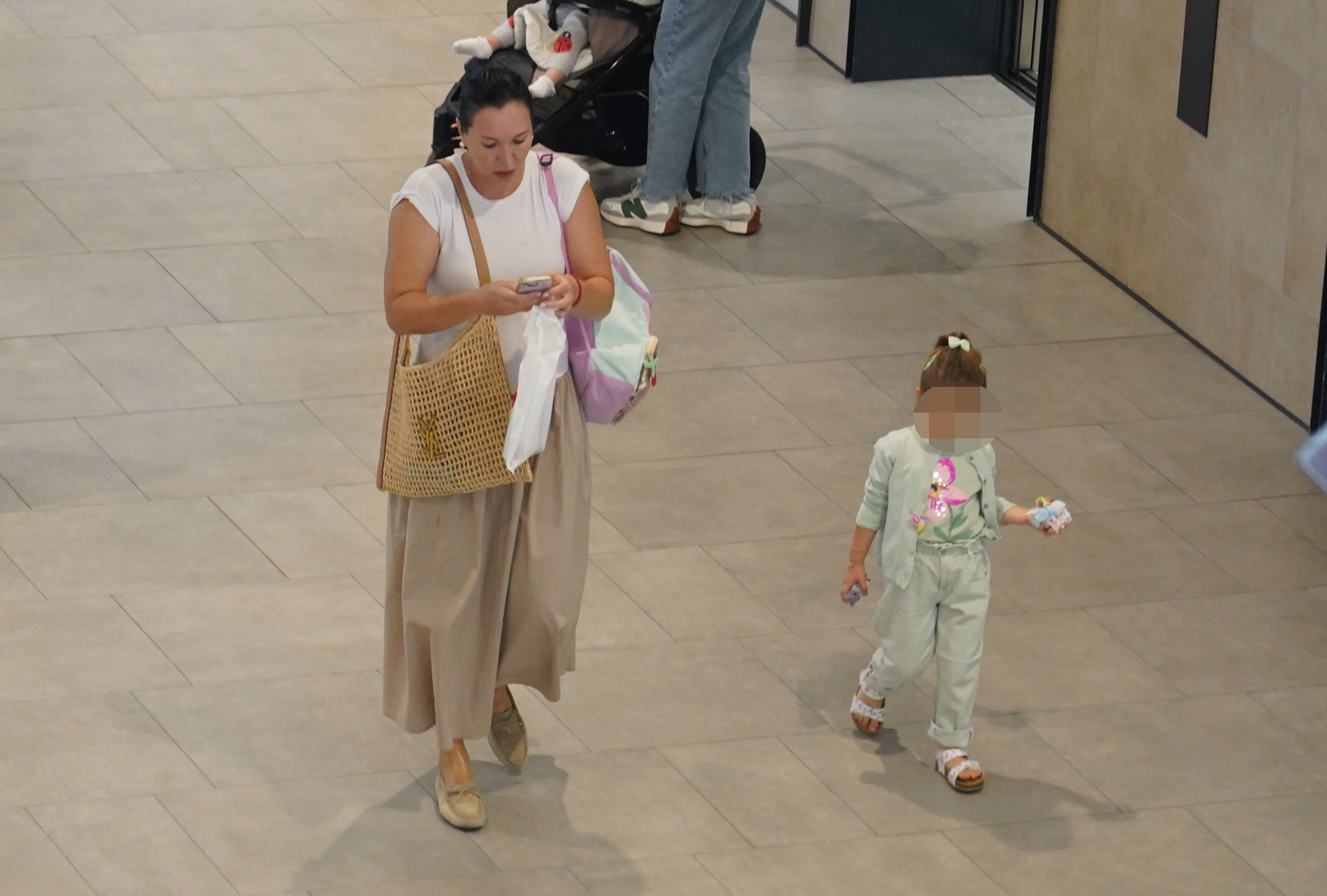 Former Serbian tennis player, former world number 1 Jelena Jankovic walking with her daughter Una in one of the Belgrade shopping centers.