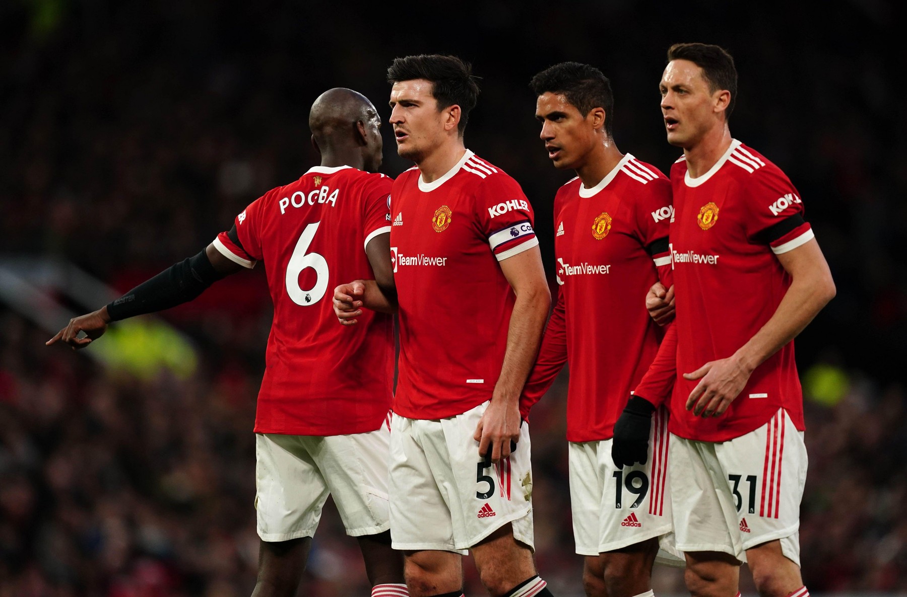 (left to right) Manchester United's Paul Pogba, Harry Maguire, Raphael Varane and Nemanja Matic line up for a wall during the Premier League match at Old Trafford, Manchester. Picture date: Saturday March 12, 2022.