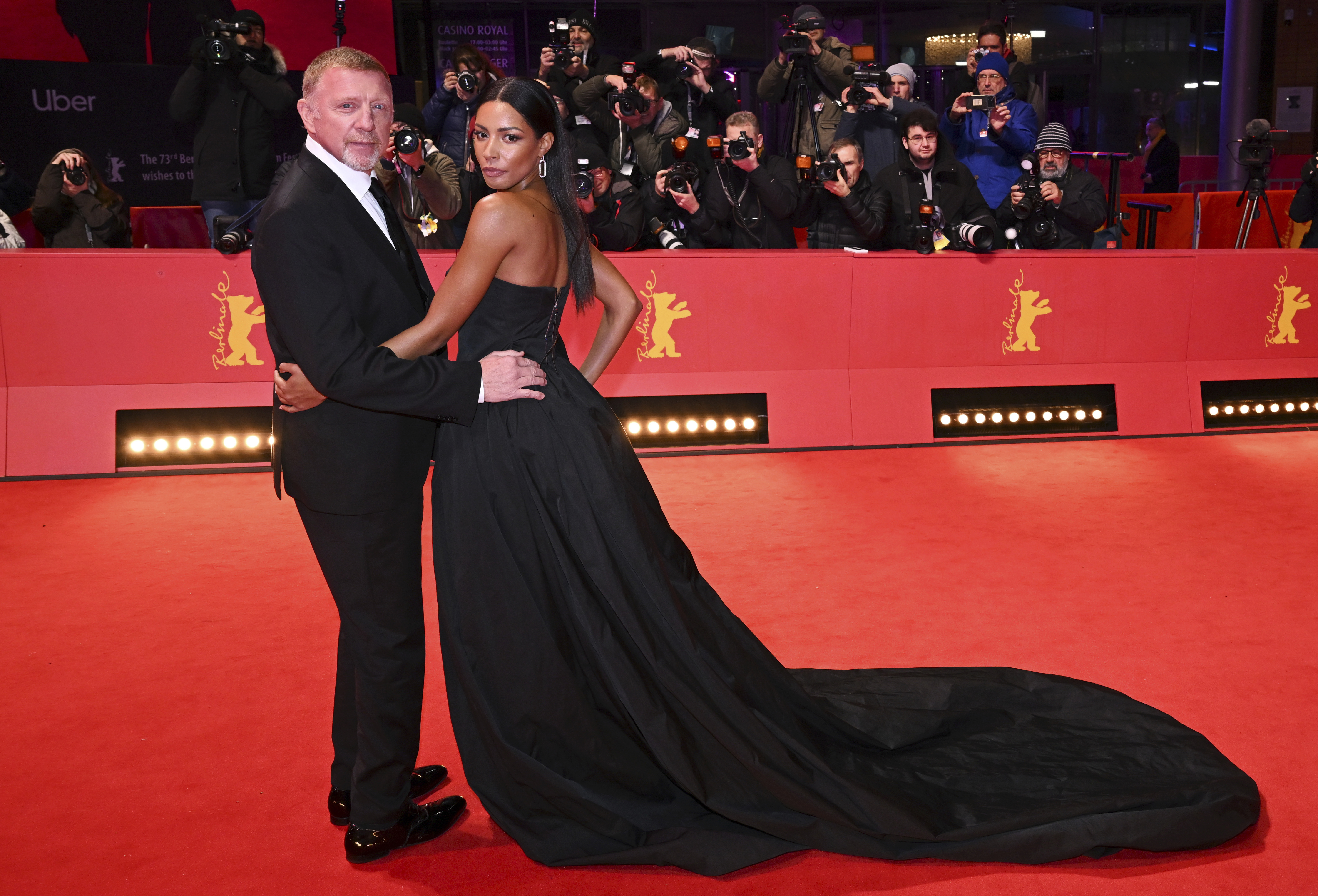 Boris Becker, left, and Lilian de Carvalho pose on the red carpet for the film "Disco Boy" at the 73rd International Film Festival in Berlin, Germany, Sunday, Feb. 19, 2023. The film festival runs until Feb. 26. (Jens Kalaene/dpa via AP)