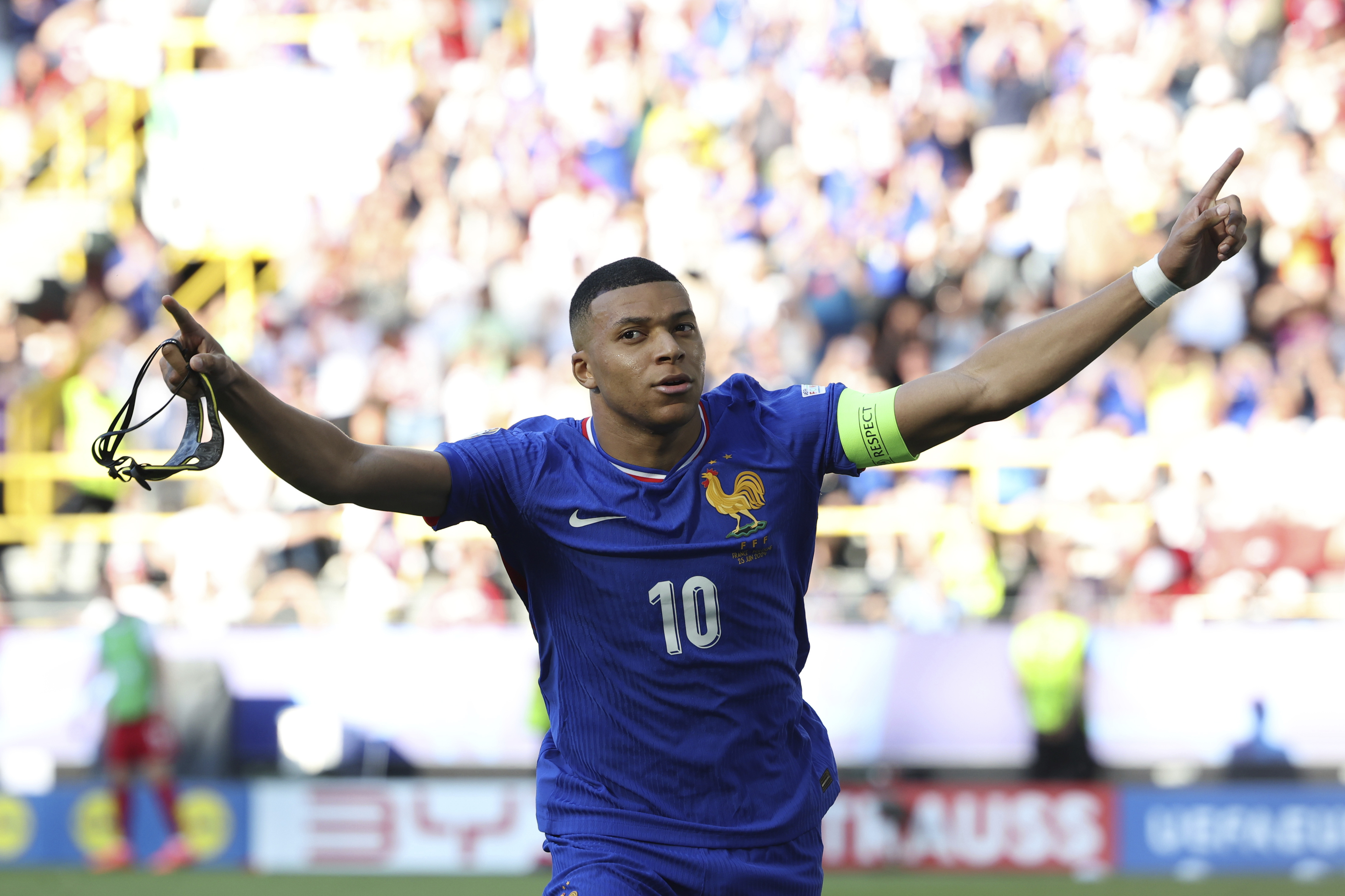 Kylian Mbappe of France celebrates after scoring a penalty kick during a Group D match between the France and Poland at the Euro 2024 soccer tournament in Dortmund, Germany, Tuesday, June 25, 2024. (Friso Gentsch/dpa via AP)