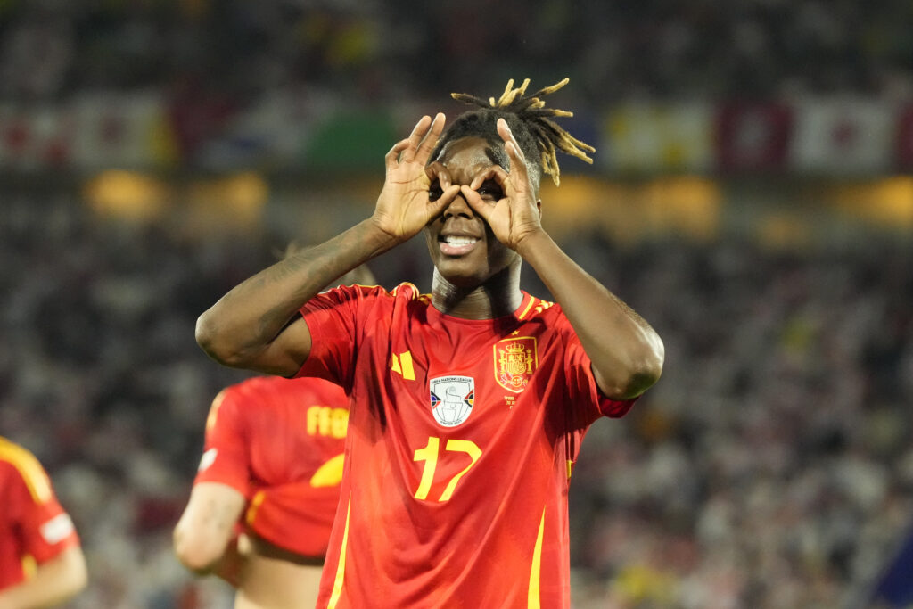 Spain's Nico Williams celebrates after scoring his side's 3rd goal against Georgia during a round of sixteen match at the Euro 2024 soccer tournament in Cologne, Germany, Sunday, June 30, 2024. (AP Photo/Frank Augstein)
