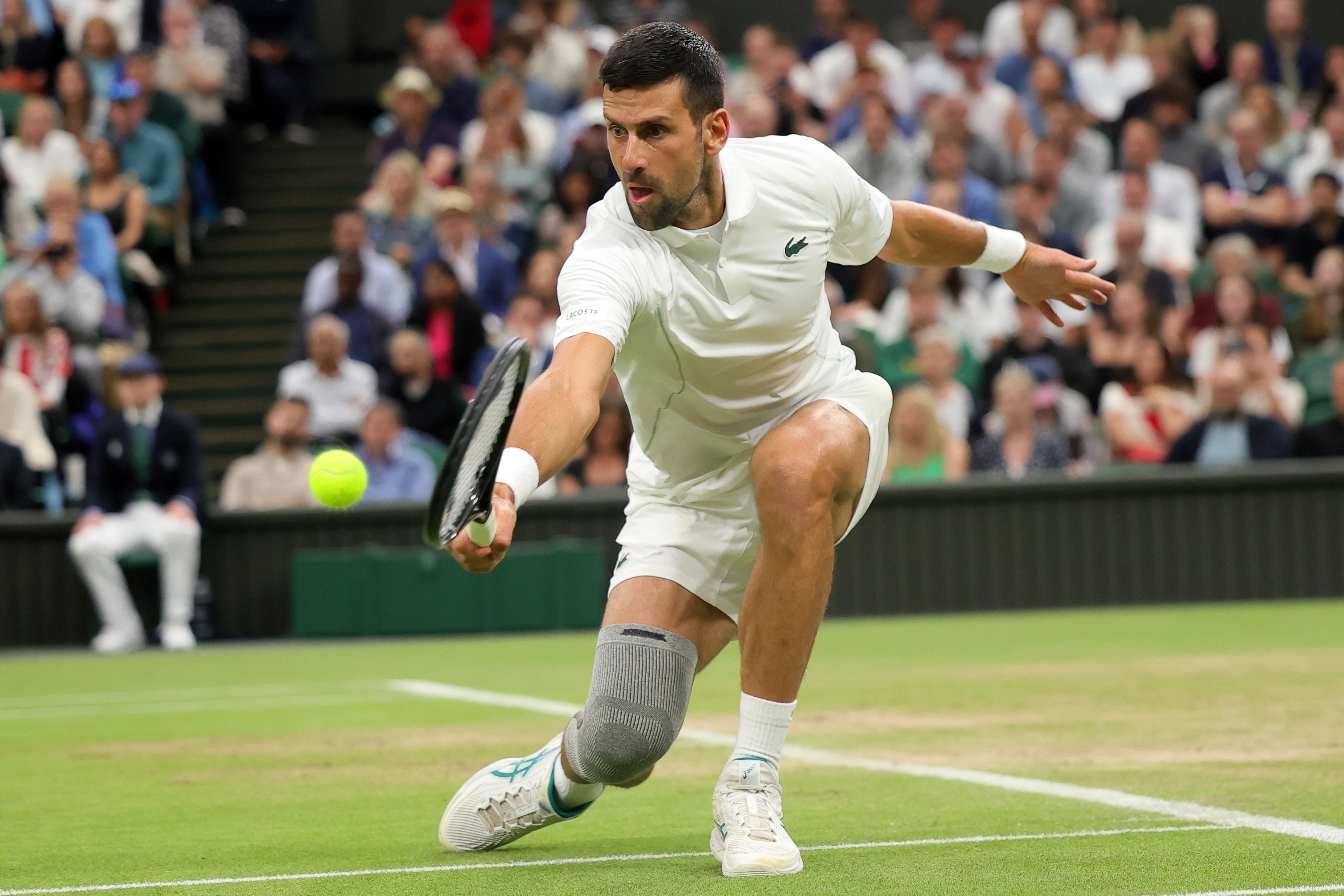 epa11467243 Novak Djokovic of Serbia in action against Holger Rune of Denmark (unseen) during their round of 16 match at the Wimbledon Championships, Wimbledon, Britain, 08 July 2024.  EPA-EFE/TIM IRELAND  EDITORIAL USE ONLY