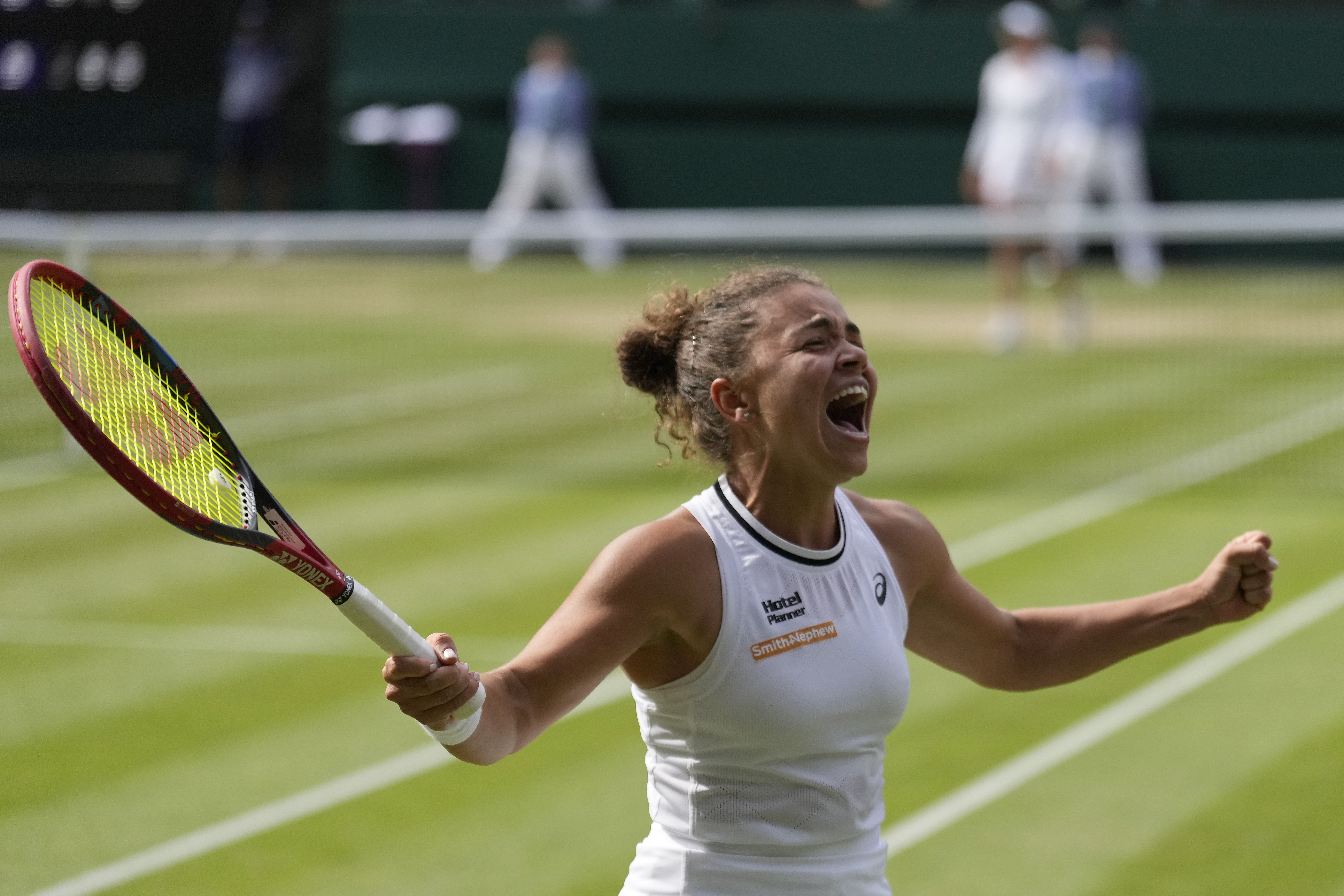 Jasmine Paolini of Italy celebrates after defeating Donna Vekic of Croatia in their semifinal match at the Wimbledon tennis championships in London, Thursday, July 11, 2024. (AP Photo/Mosa'ab Elshamy)