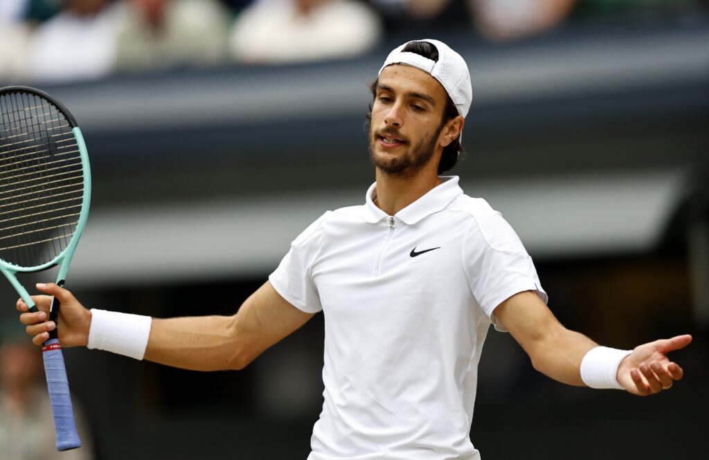 epa11474907 Lorenzo Musetti of Italy reacts during the Men's semifinal match against Novak Djokovic of Serbia at the Wimbledon Championships, Wimbledon, Britain, 12 July 2024.  EPA-EFE/TOLGA AKMEN  EDITORIAL USE ONLY