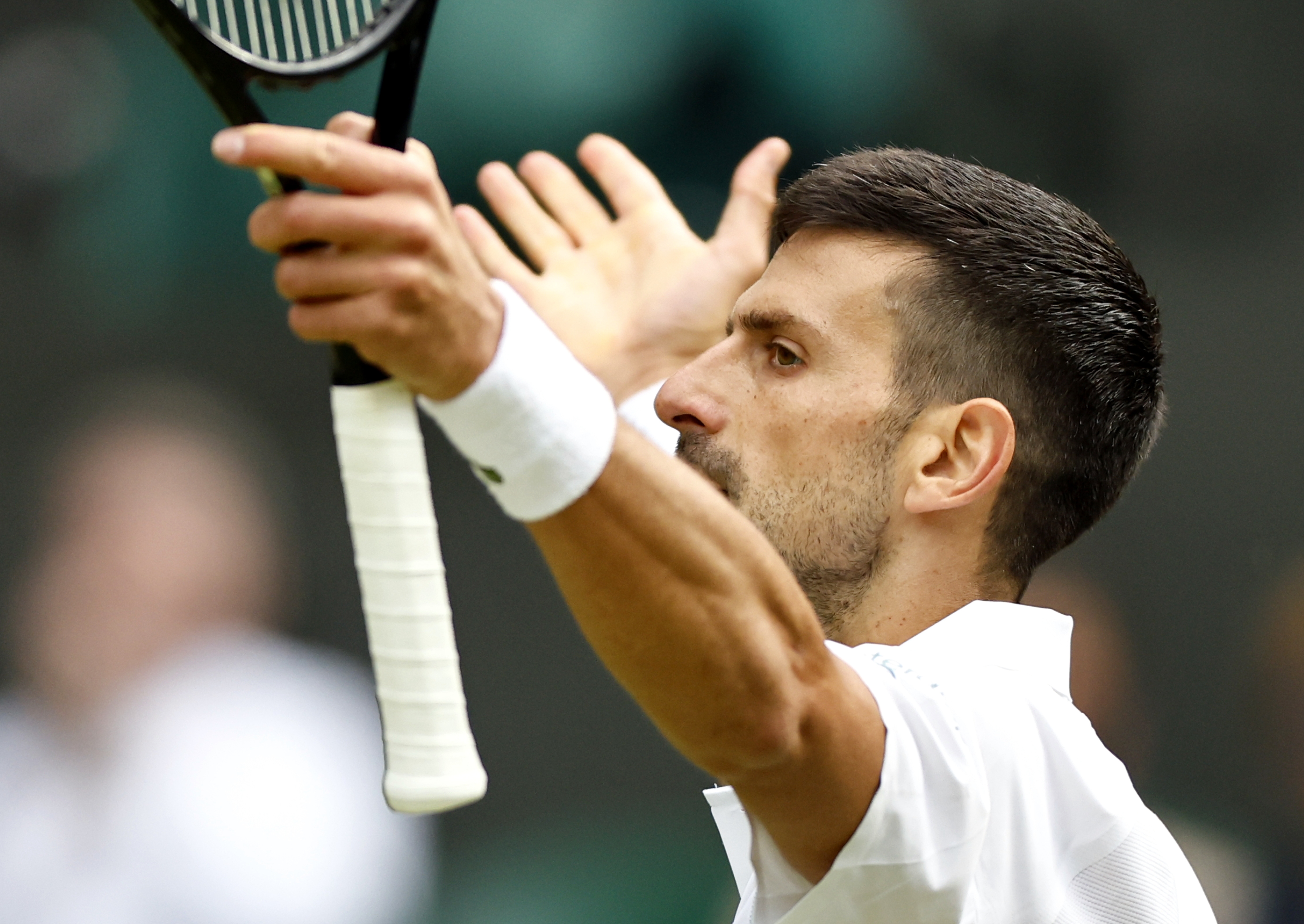 epa11474661 Novak Djokovic of Serbia reacts after winning a game during the Men's semifinal match against Lorenzo Musetti of Italy at the Wimbledon Championships, Wimbledon, Britain, 12 July 2024.  EPA-EFE/TOLGA AKMEN  EDITORIAL USE ONLY