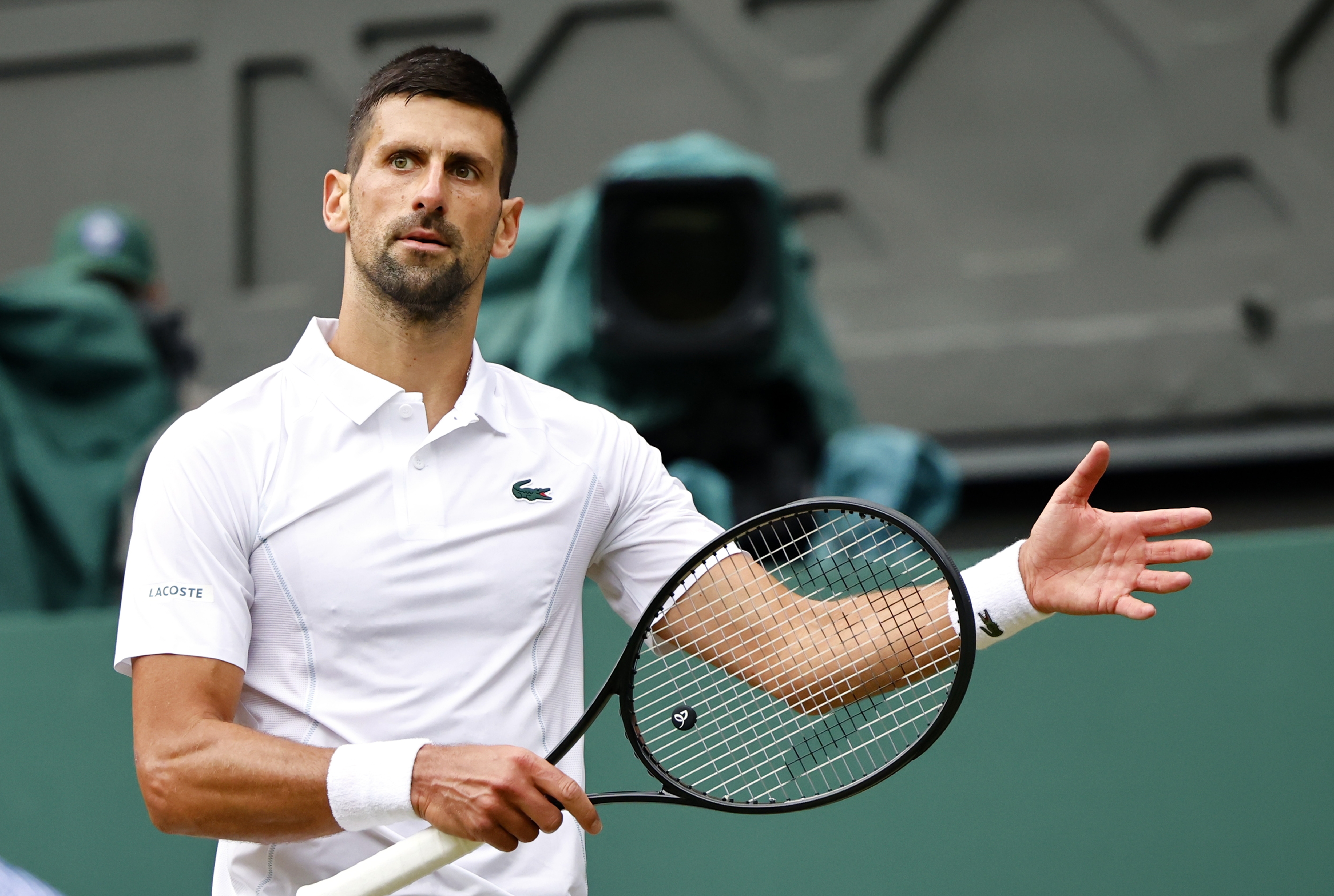 epa11474697 Novak Djokovic of Serbia reacts after losing a set point during the Men's semifinal match against Lorenzo Musetti of Italy at the Wimbledon Championships, Wimbledon, Britain, 12 July 2024.  EPA-EFE/TOLGA AKMEN  EDITORIAL USE ONLY