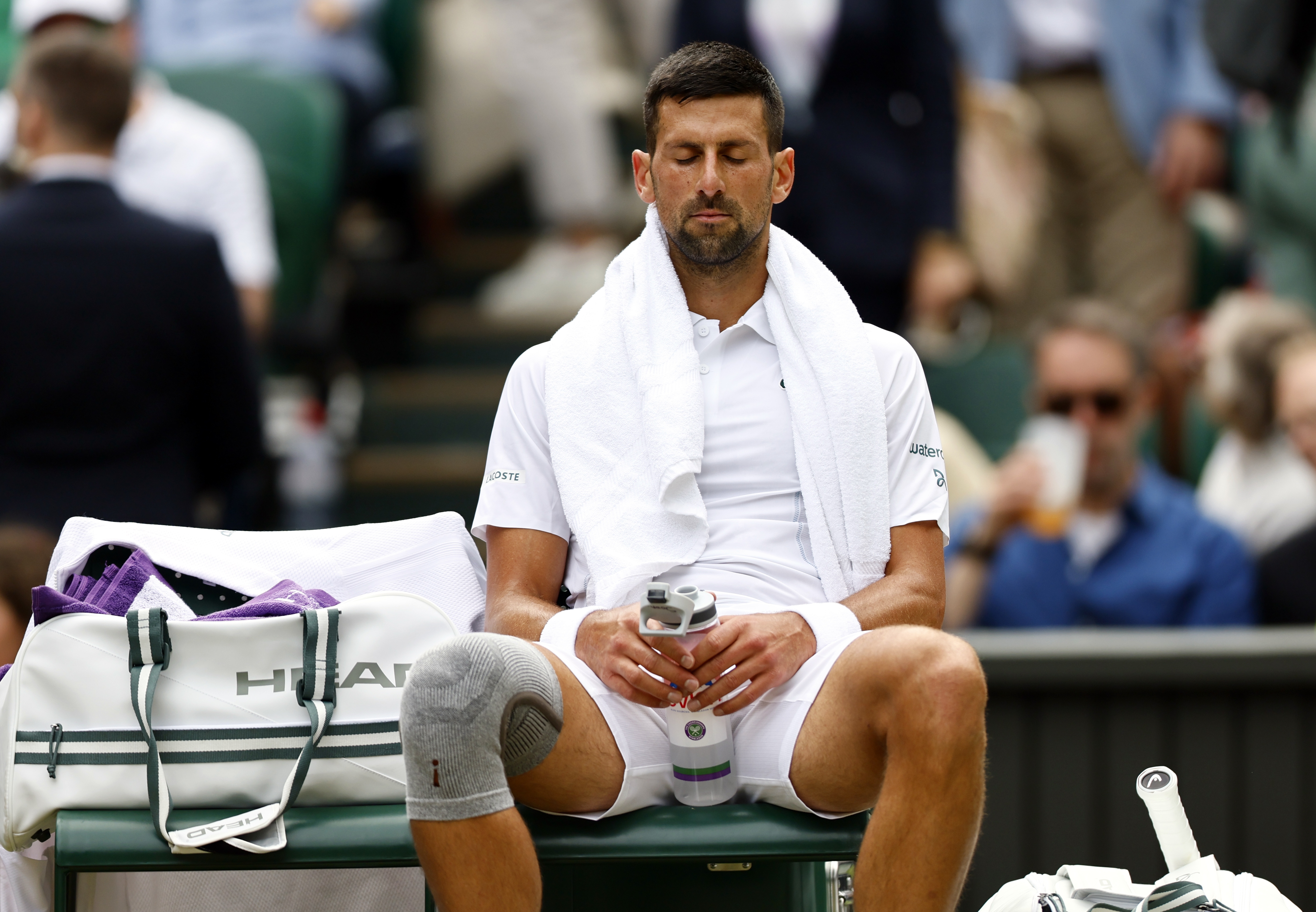 epa11474685 Novak Djokovic of Serbia reacts during a break during the Men's semifinal match against Lorenzo Musetti of Italy at the Wimbledon Championships, Wimbledon, Britain, 12 July 2024.  EPA-EFE/TOLGA AKMEN  EDITORIAL USE ONLY