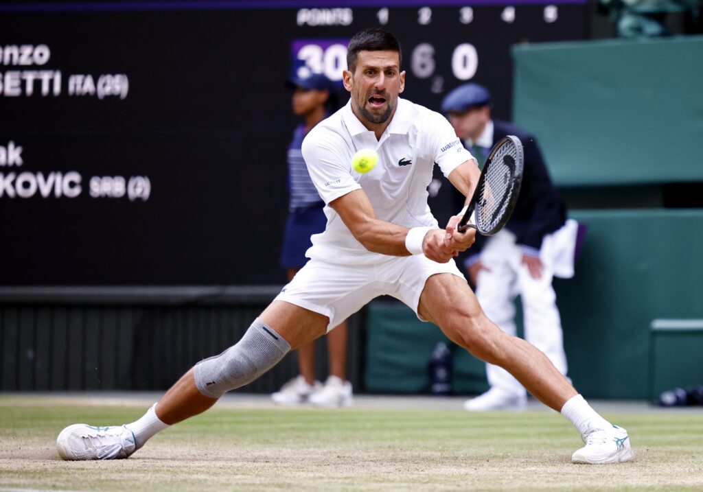 epa11474917 Novak Djokovic of Serbia in action during the Men's semifinal match against Lorenzo Musetti of Italy at the Wimbledon Championships, Wimbledon, Britain, 12 July 2024.  EPA-EFE/TOLGA AKMEN  EDITORIAL USE ONLY