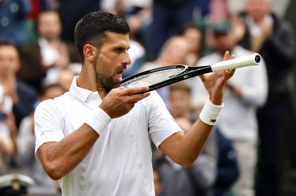 epa11474978 Novak Djokovic of Serbia reacts after winning the Men's semifinal match against Lorenzo Musetti of Italy at the Wimbledon Championships, Wimbledon, Britain, 12 July 2024.  EPA-EFE/TOLGA AKMEN  EDITORIAL USE ONLY