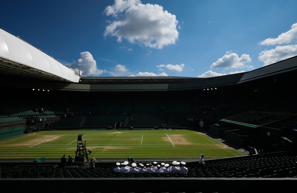 epa11477115 Service Stewards line up for a group photograph on Centre Court ahead of the men’s singles final at the Wimbledon Championships in London, Britain, 14 July 2024.  EPA-EFE/ADAM VAUGHAN