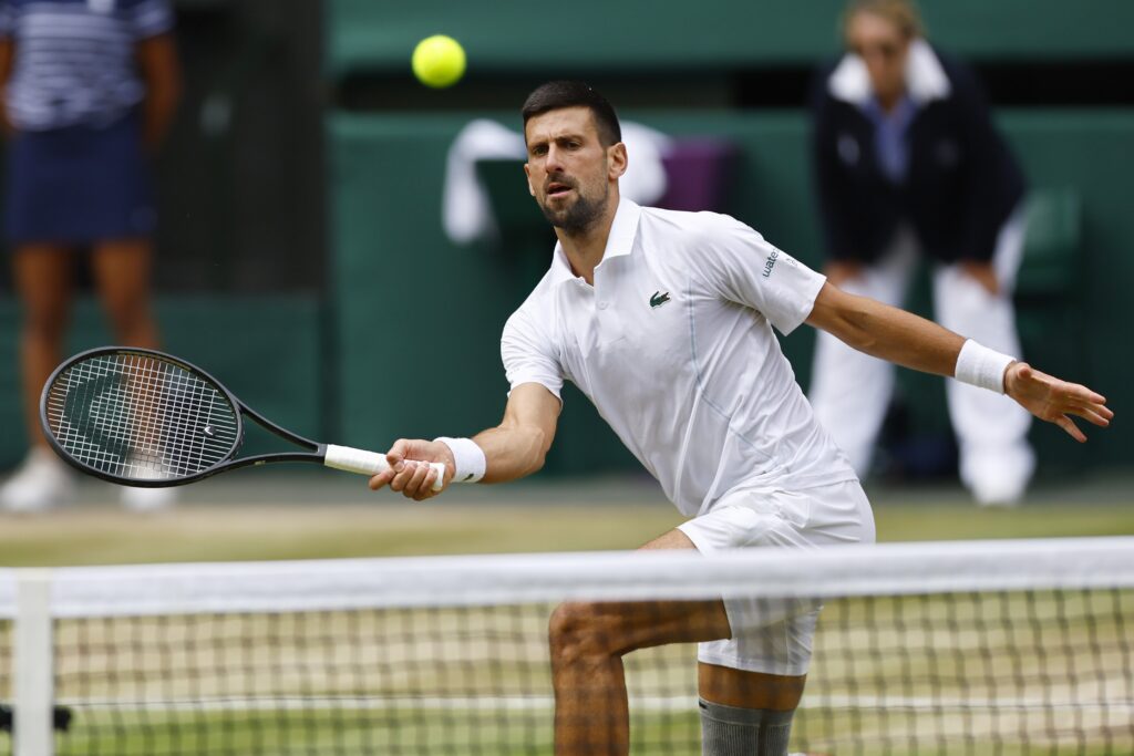 epa11477417 Novak Djokovic of Serbia in action during the men's singles final  against Carlos Alcaraz of Spain at the Wimbledon Championships, Wimbledon, Britain, 14 July 2024.  EPA-EFE/TOLGA AKMEN  EDITORIAL USE ONLY